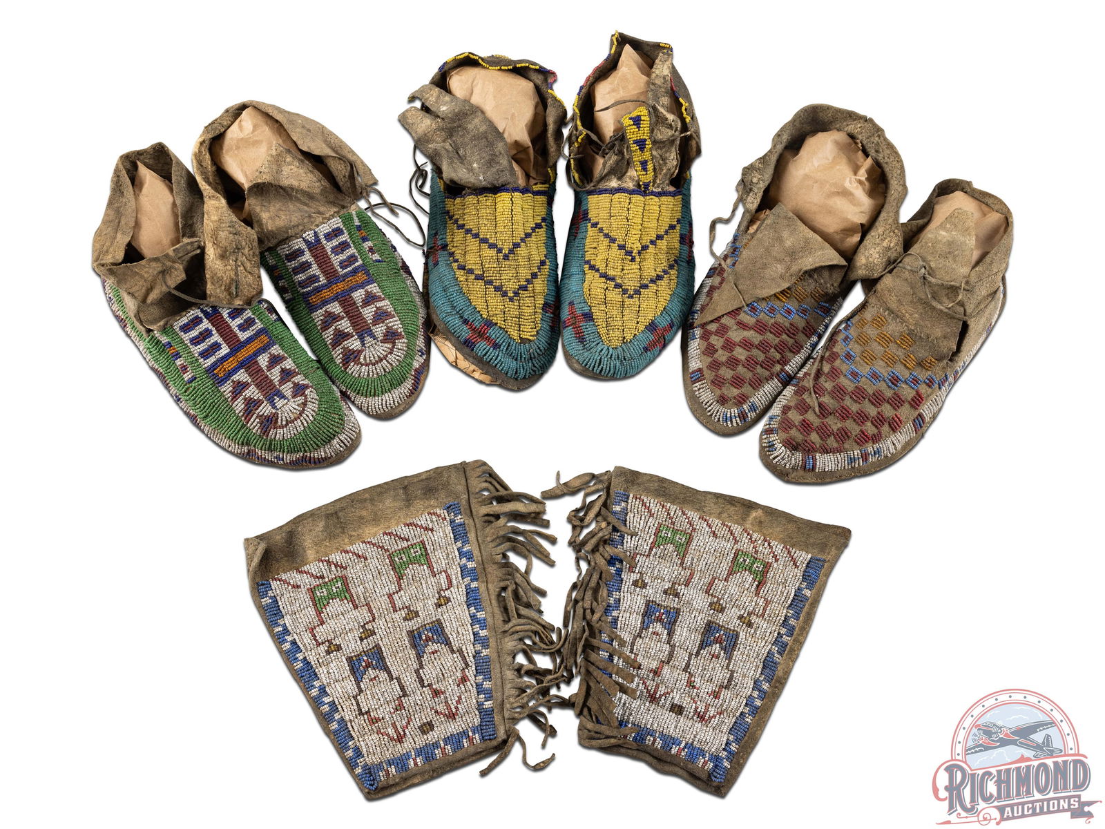 Antique Native American Sioux / Lakota Beaded Leather Moccasins & Ceremonial Cuffs: Handmade turn of the century, three pairs of Native American moccasins and a pair of ceremonial cuffs. All pieces in this collection are made of leather with beautiful hand-beading art. Cuffs are frin