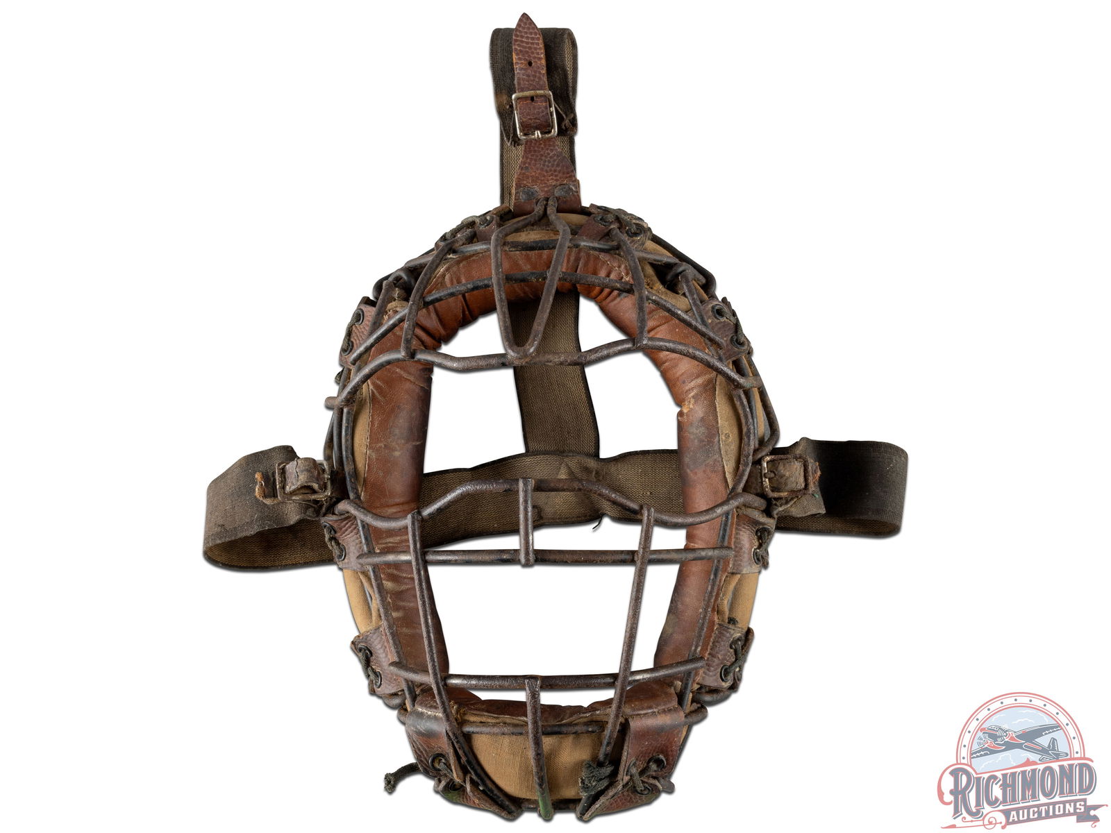 Winchester No. 2204 Baseball Catcher's Mask "Spitter" Model: Original Winchester curved visions, "Spitter" model catcher's mask. Electrically welded wire mask is intact and exhibits oxidation and wear. Continuous curled, hair-filled leather and canvas pads have