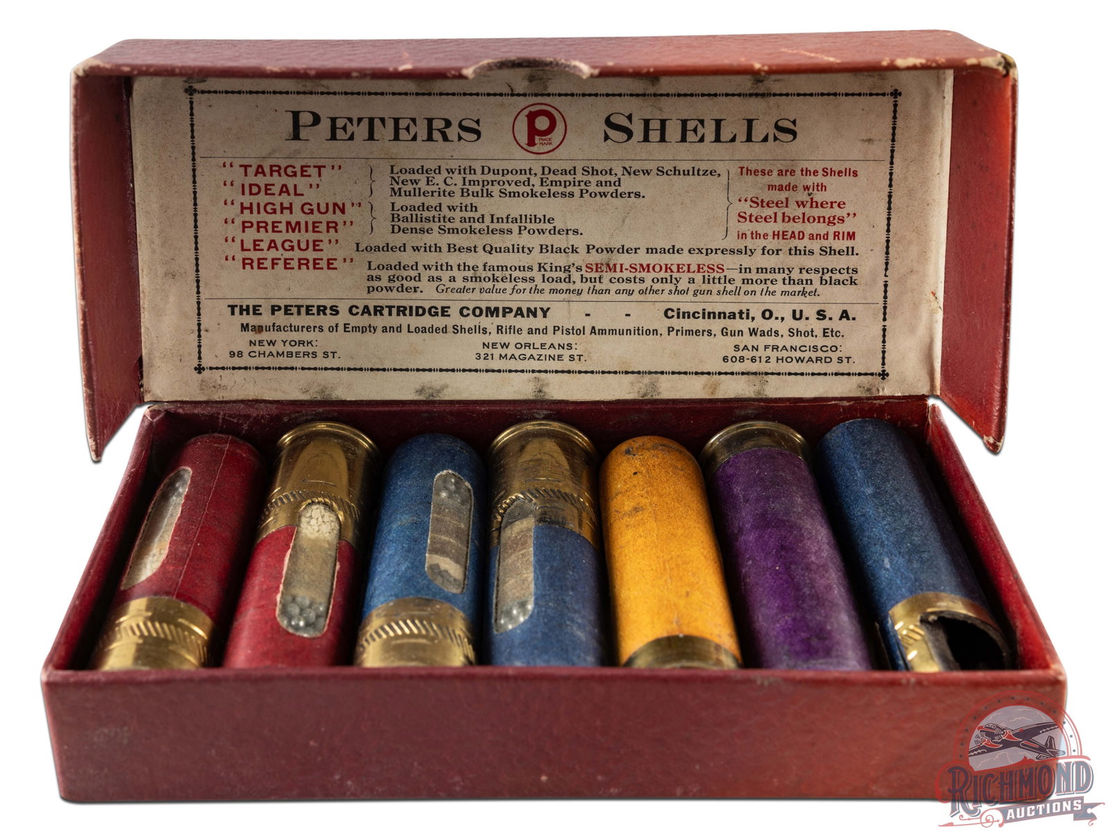 Peters Cartridge Company Salesman Dummy Sample Kit: Peters Cartridge Company of Cincinnati, Ohio shotgun shell dummy sample kit with "Target, Ideal, High Gun, Premier, League and Referee" Window shells in hinged purple scale carboard box.