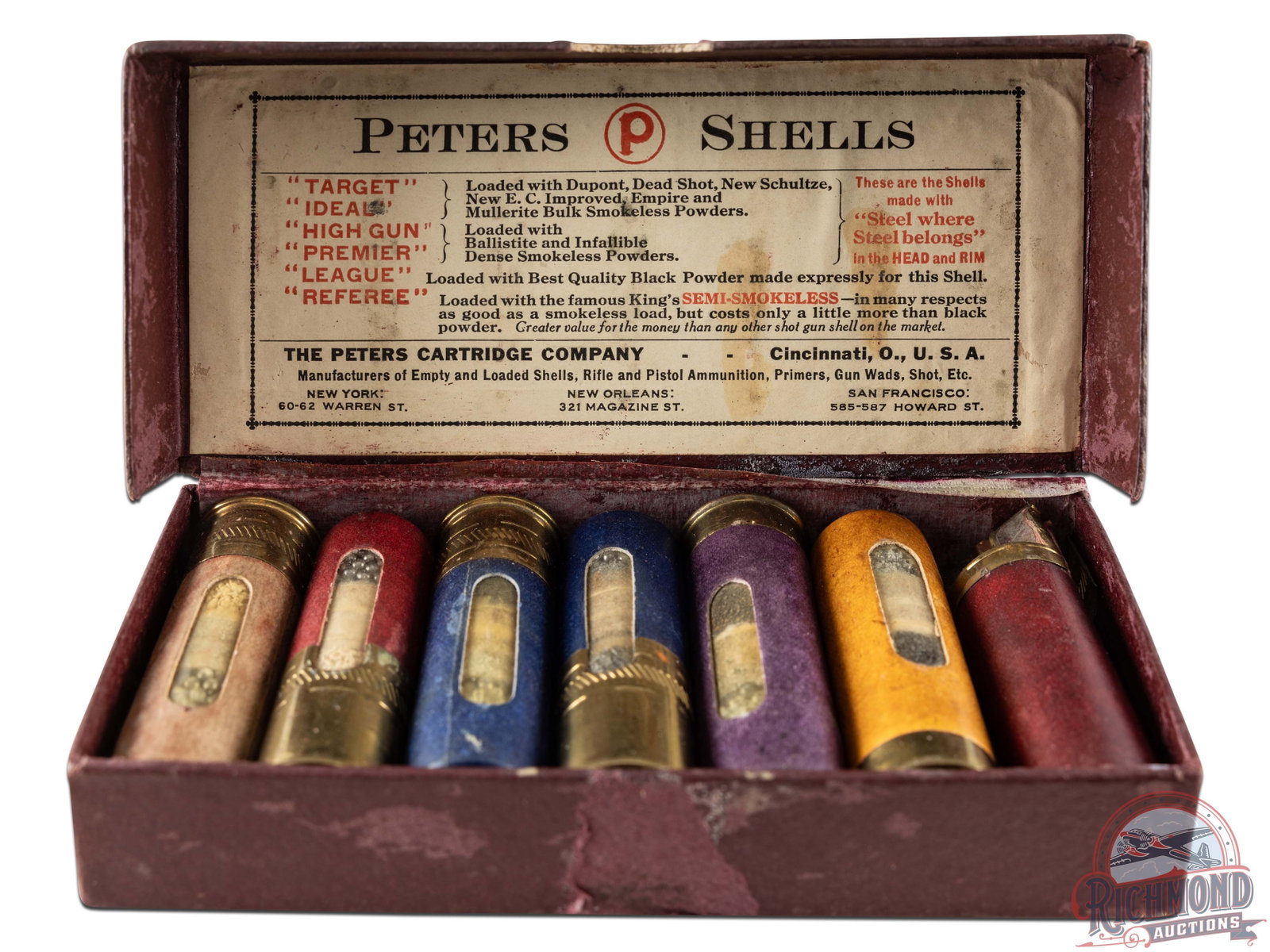 Peters Cartridge Company Salesman Dummy Sample Kit: Peters Cartridge Company of Cincinnati, Ohio shotgun shell dummy sample kit with "Target, Ideal, High Gun, Premier, League and Referee" Window shells in hinged purple scale cardboard box.
