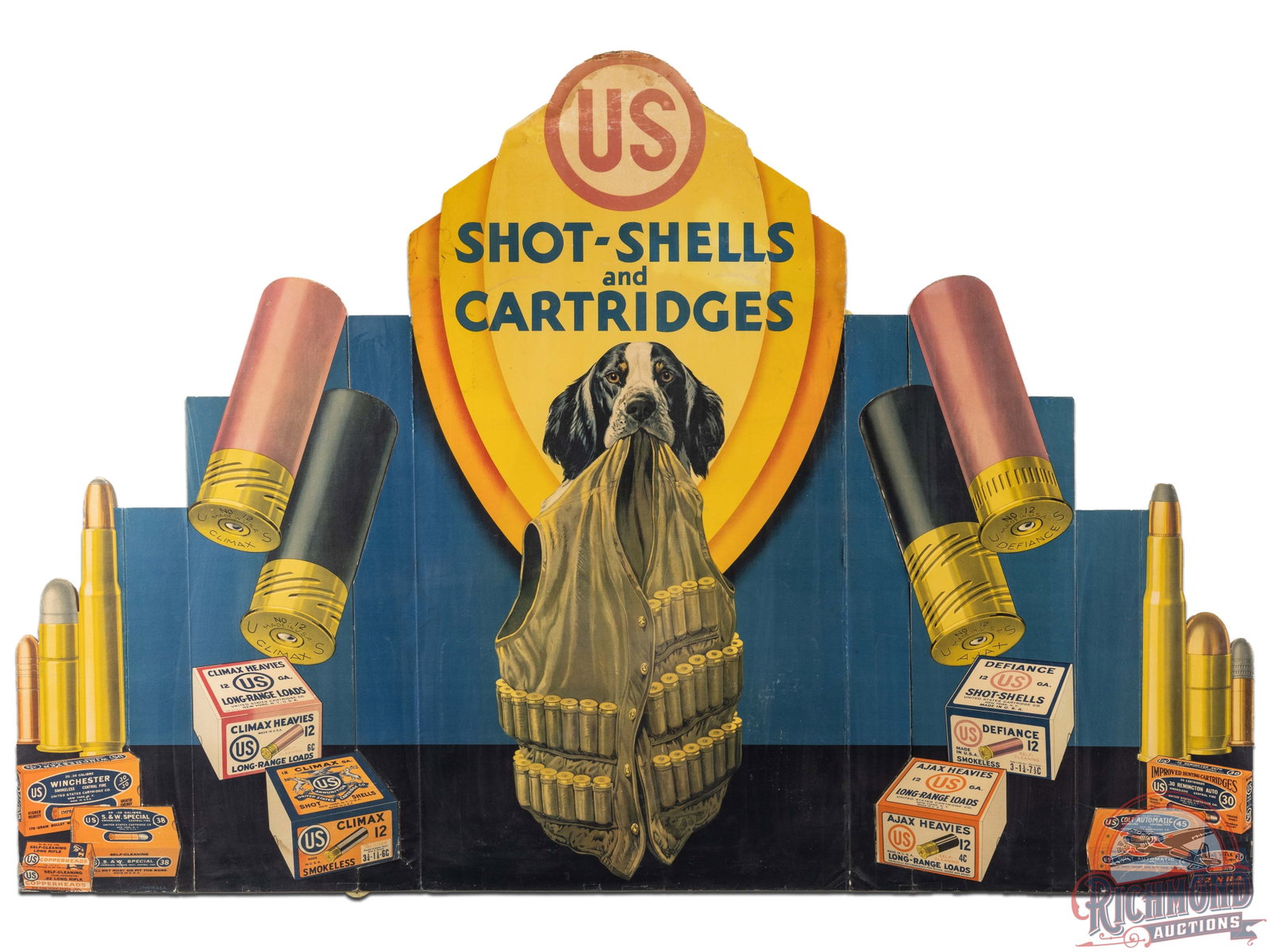 1931 US Cartridge Co Shot Shells & Cartridges Countertop Display Sign w/ Hunting Dog & Vest: Large cardboard die cut sign with excellent graphics and moderate color, circa 1931. Featuring a hunting dog holding a shooting vest and ready to go! Multiple boxes of shotguns shells and rifle cartri