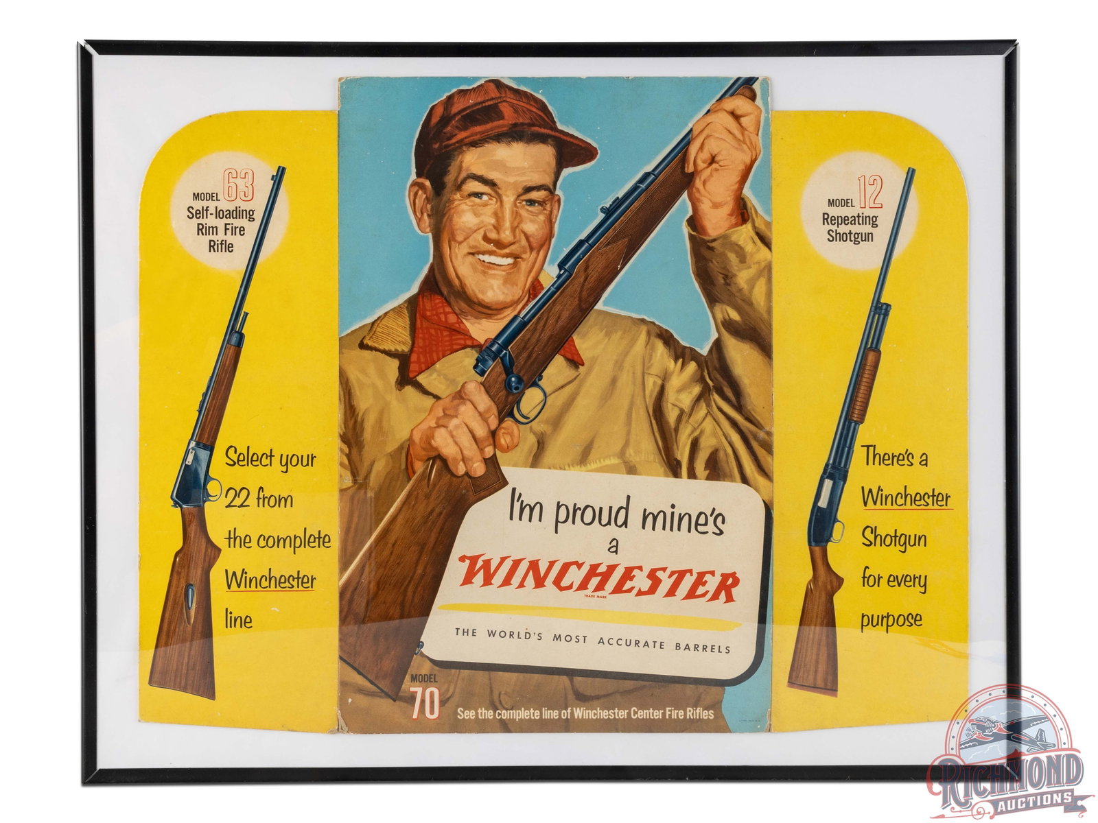 "I'm Proud Mine's a Winchester" Countertop Easel Back Cardboard Sign: Nice easel back folding cardboard counter sign advertising the Model 63, Model 70 and Model 12. Presents with excellent color, mild corner/edge wear, general surface wear and one slight crease in the 