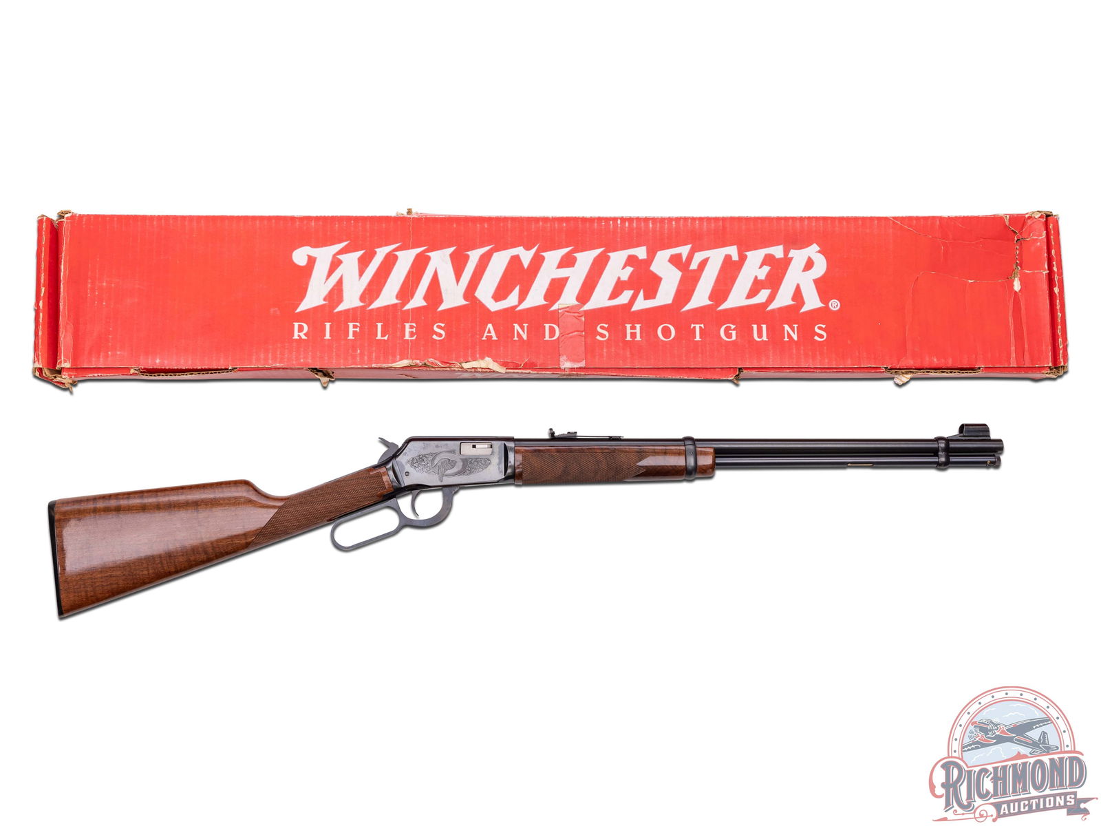 New Old Stock 1972 Winchester 9422 High Grade Lever Action .22 S/L/LR Engraved Rifle: Manufactured in 1972, this high grade lever action has never been fired. Features a 20-1/2" blued barrel with standard Winchester stampings and proof marks, hooded front iron sight and rear adjustable
