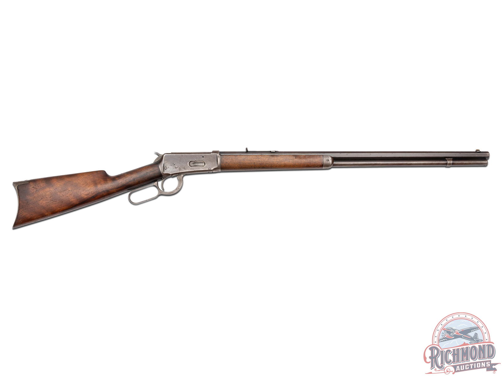 Antique Winchester Model 1894 Rifle in 38-55 Caliber: Made by Winchester Repeating Arms Company in 1897. 26" blued octagon Winchester Steel barrel in 38-55 caliber with sheared blade front sight, Buckhorn rear sight, Winchester two line barrel address an