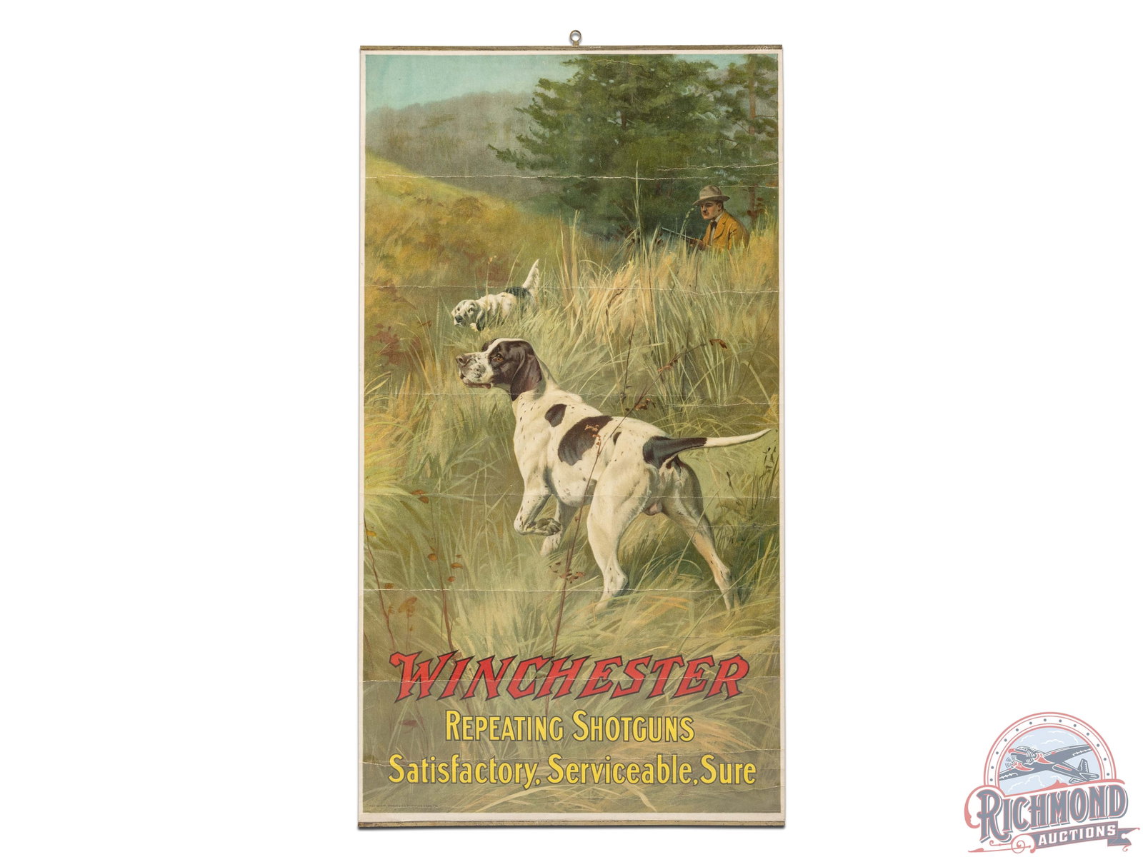 Winchester Repeating Shotguns "Satisfactory, Serviceable, Sure" Paper Poster: Colorful lithograph paper advertising poster sign featuring two bird dogs and a hunter through a field. The poster presents with general age related storage wear and horizontal creasing throughout. In