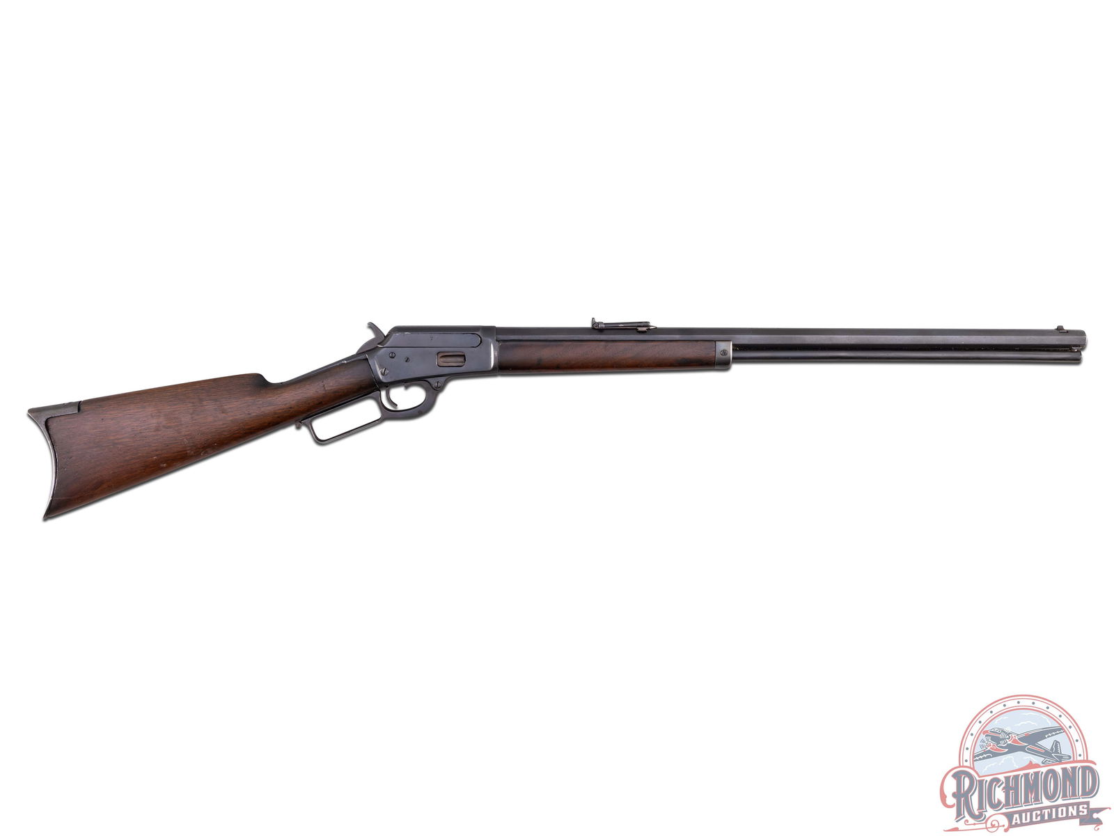 Antique Marlin Model 1889 Lever Action Rifle in 32-20 Winchester: Made by Marlin Firearms Company in 1890. One of approximately 15,000 made in this caliber. Blued 24" octagon barrel with Pedestal bead front sight and graduated rear flip sight. Barrel is marked with