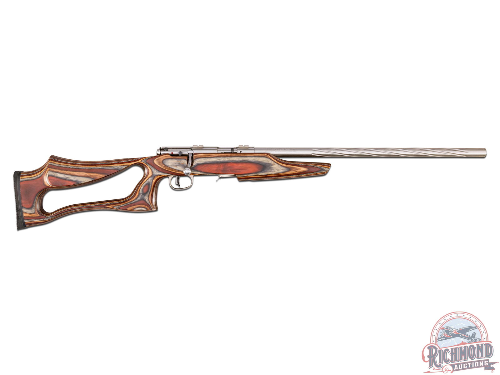Savage Model 93R17 Bolt Action Rifle in .17 HMR Caliber: Made in Canada for Savage Arms. Rifle has tapered medium weight fluted 20" stainless finish sightless barrel in .17HMR caliber. Stainless finish bolt action with 5 round detachable magazine and scope