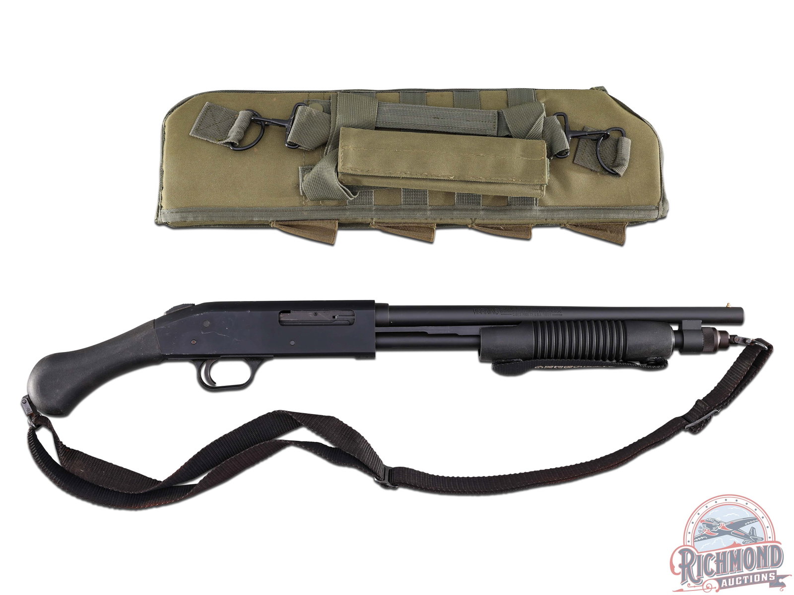 Mossberg 590 Shockwave Pistol Grip .410 Gauge Shotgun with Tactical Scabbard: Manufactured in the USA by Mossberg on the 590 shotgun frame. This Shockwave features a 14-3/8" barrel with brass bead front sight. Chambered for 2-1/2" and 3" shells. Matte black finish throughout. F