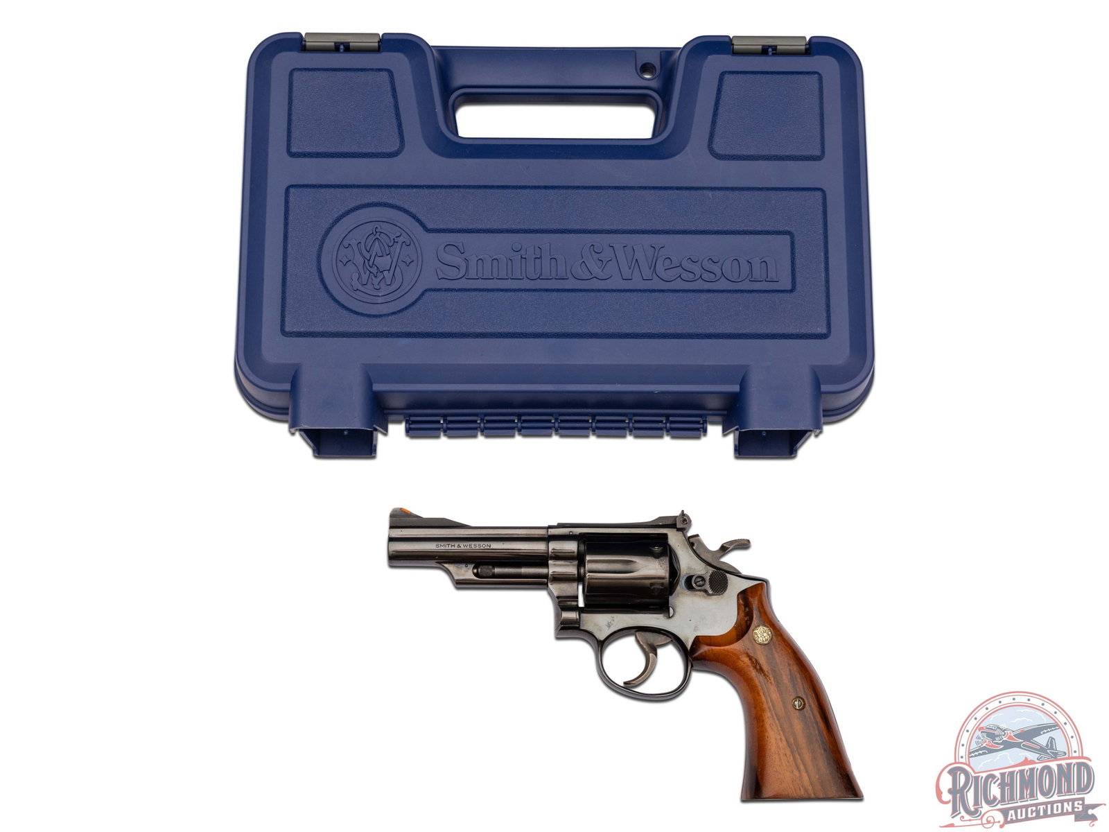 Smith & Wesson Model 19-3 Combat Magnum .357 MAG 4" Revolver: Manufactured circa 1971. Features a 4" barrel with red highlighted ramp front sight and white outlined rear adjustable notch sight. Blued finish with a 6 round swing-out fluted cylinder chambered for 
