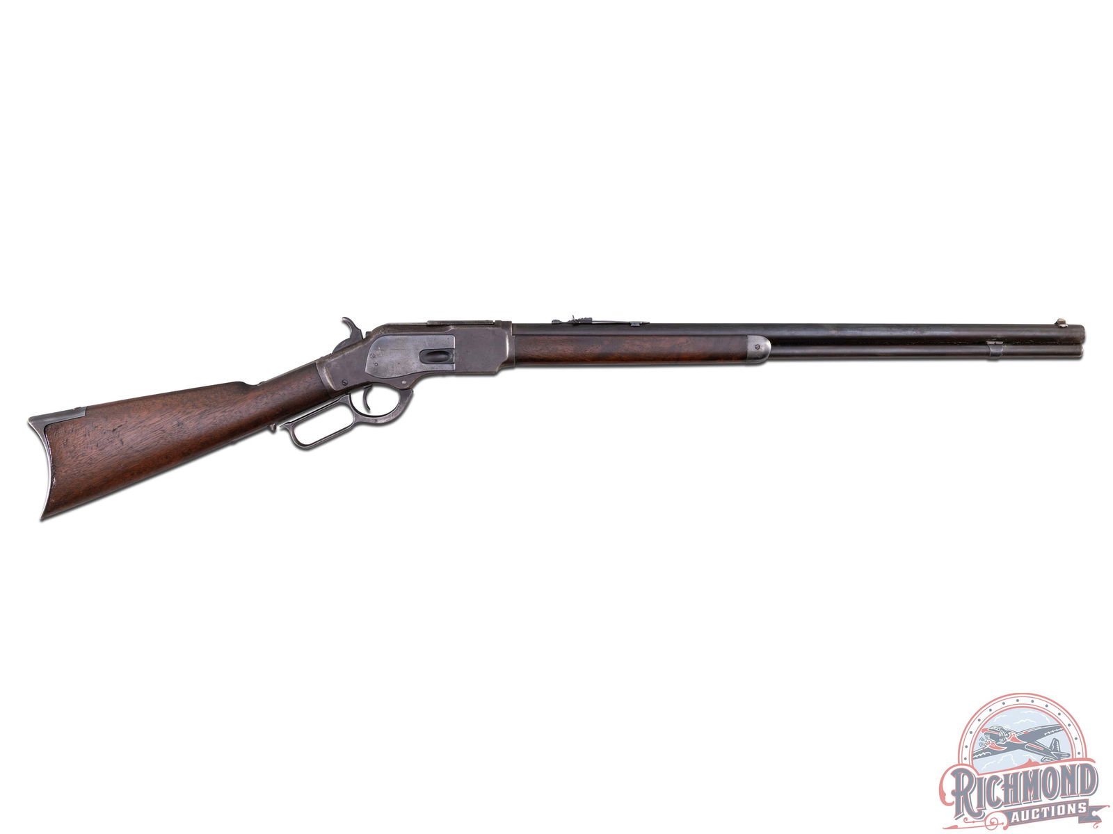Antique Winchester Model 1873 Rifle in 38-40 W.C.F.: Made in 1886 by Winchester Repeating Arms. Blued 24" round Winchester Steel barrel with standard markings, correct front sight and replaced rear sight in 38-40 W.C.F. caliber. Blued 3rd Model receiver