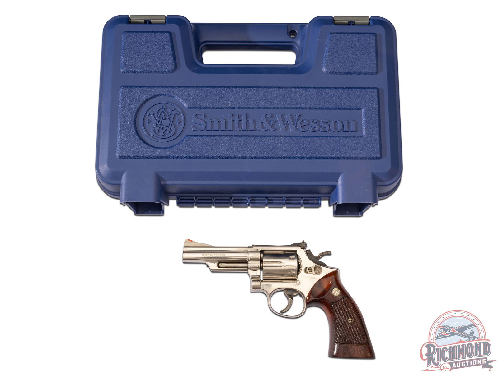 Smith & Wesson Model 19-3 Combat Magnum .357 MAG Nickel 4" Revolver in Factory Case: Manufactured circa 1970. Features a 4" pinned (and recessed cylinder) barrel with red highlighted ramp front sight and white outlined rear adjustable notch sight. Nickel finish with a 6 round swing-ou