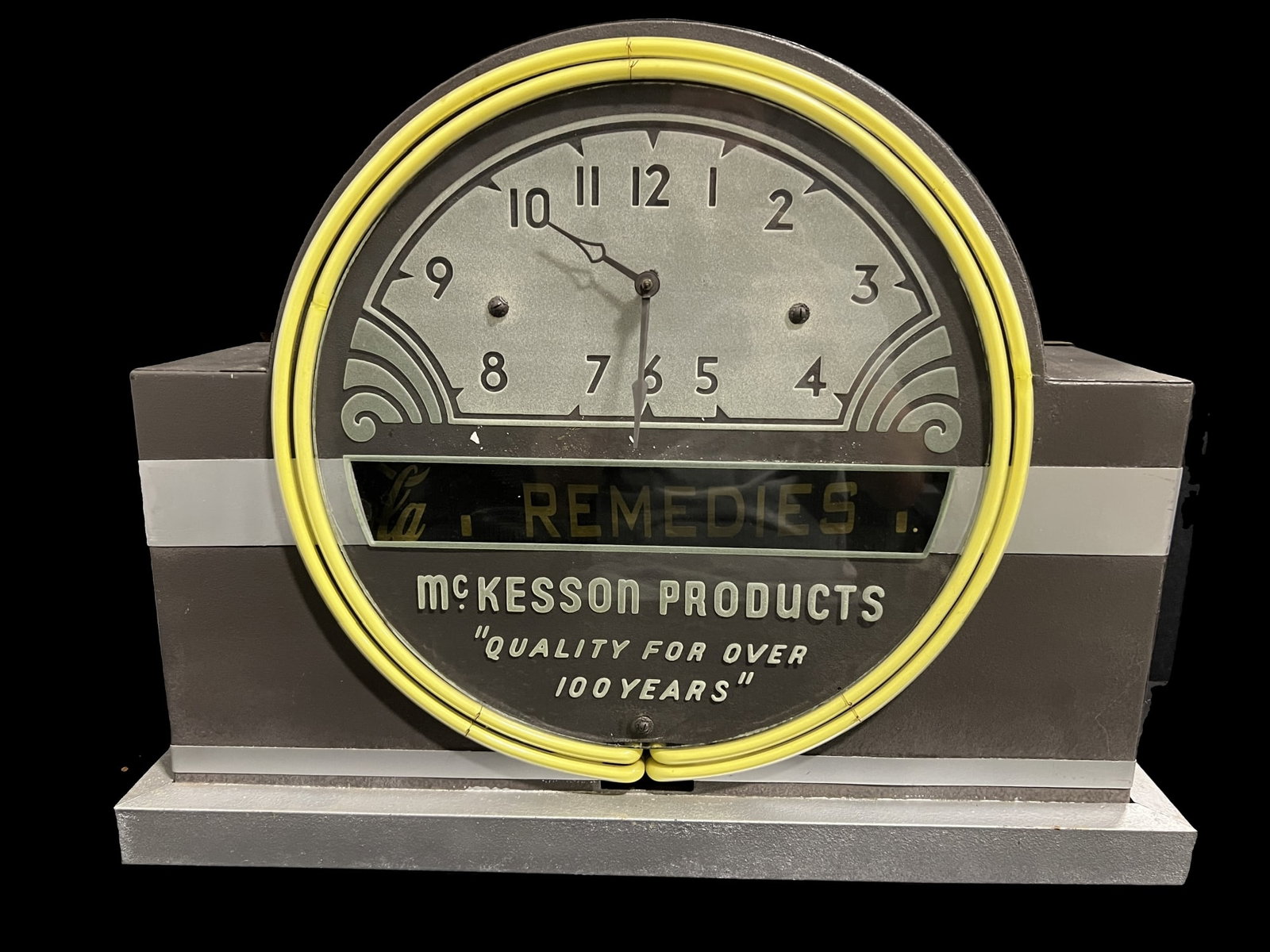 Mckesson Products Coca Cola Coke Acid Etched Neon Clock: Ticker tape scrolls and says: Vitamins elixirs ointments Coca Cola Remedies Liniments. Neon works. Switches on side work to cut neon off/on and tape on/off. Clock isn't functioning. Very heavy piece.