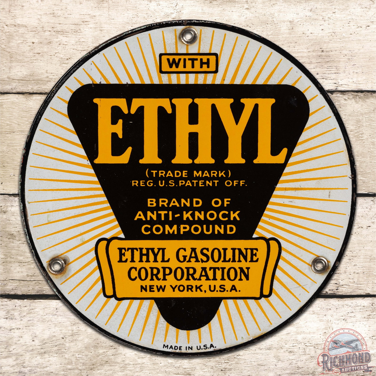 Ethyl Gasoline Corporation 8" Single Sided Porcelain Pump Plate Sign: SSP (single sided porcelain) sign has very good color and gloss. The field is clean. The outer fields have areas of discoloration and light wear to the white porcelain. The perimeter has a small chip 