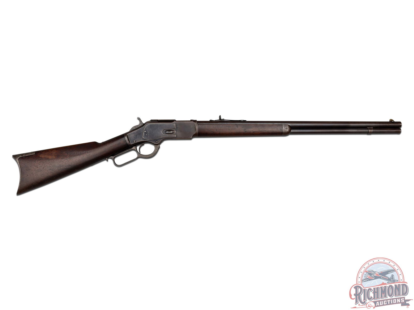 Antique Winchester Model 1873 Lever Action .38 WCF Rifle: Manufactured by Winchester in 1882. This rifle features a 24" round "King's Improvement Patented" barrel with rear elevation semi-buckhorn sight and brass blade front sight. Barrel is stamped with the