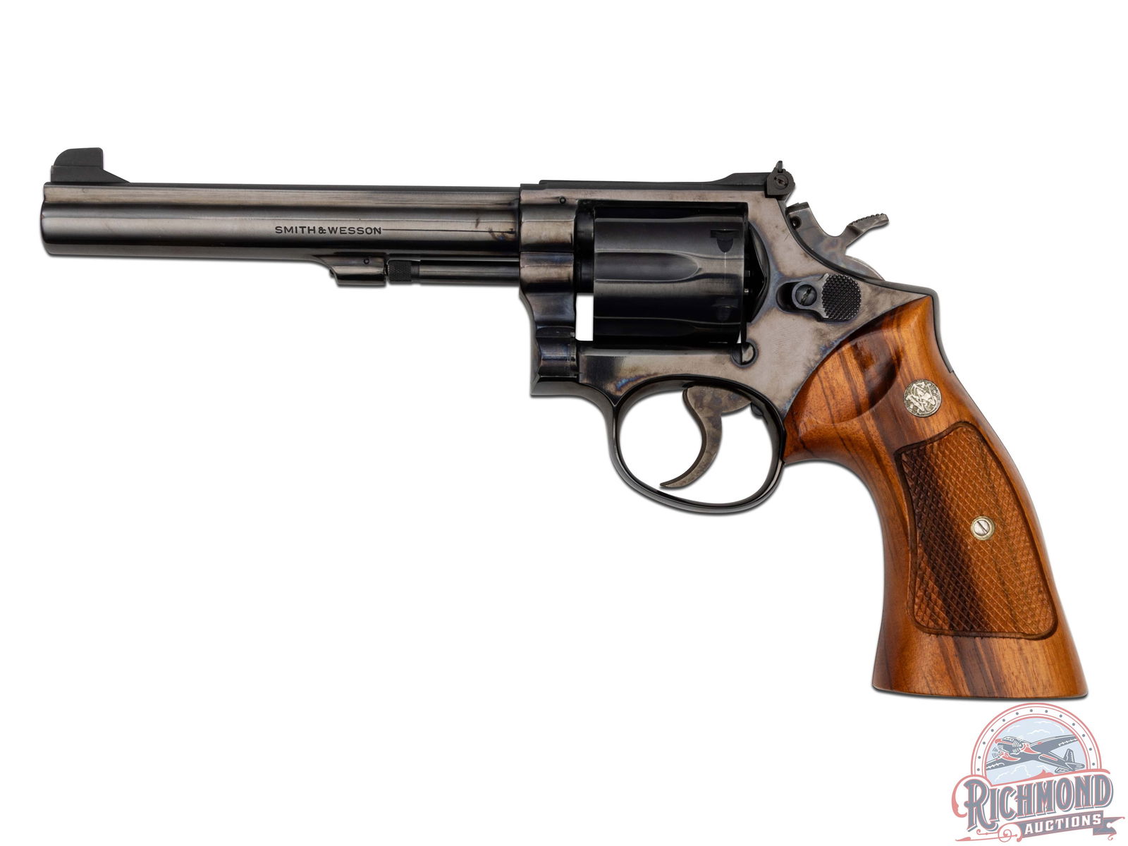 1969 Smith & Wesson Model 14 K-38 Masterpiece .38 SPL 6" Revolver: This revolver was manufactured by Smith & Wesson in 1969. Features a 6" pinned and ribbed barrel with rear micrometer click adjustable notch sight and Patridge front. Blued finish with a six-round flu
