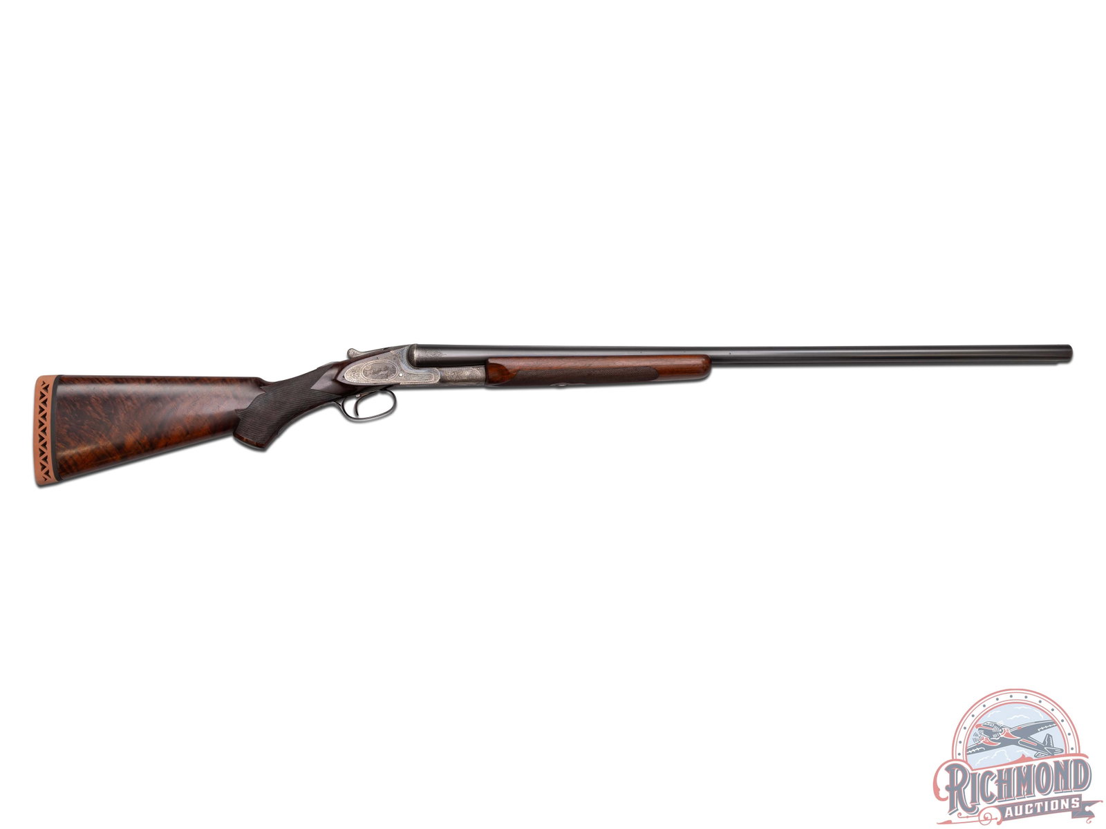 Stunning 1921 L.C. Smith Engraved & Gold Inlaid Crown Grade 12 GA Side by Side Shotgun: Manufactured by L.C. Smith Hunter Arms Co. in 1921. Includes Cody Research record that confirms all factory configurations. This gun is one of 639 made total in 12 gauge, one of 322 made with 32" barr