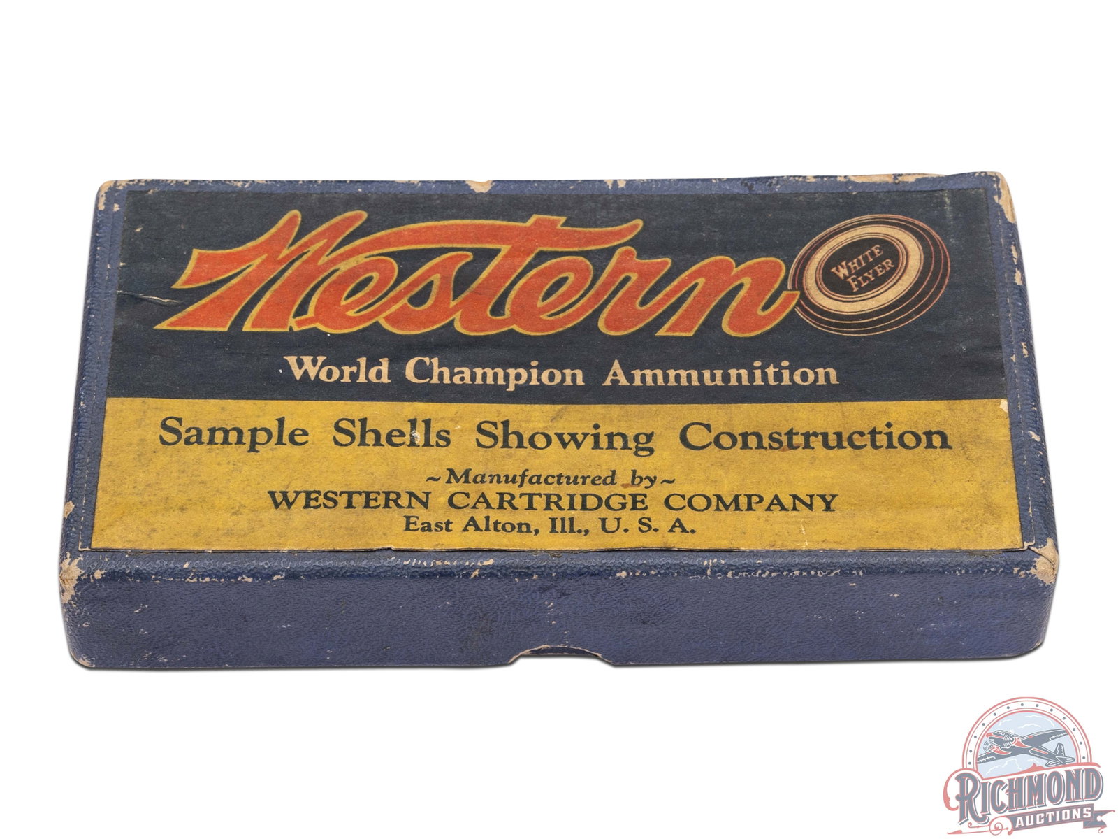 Western Cartridge Company World Champion Ammunition Salesman 12 GA Dummy Sample Kit: Western Cartridge Company of East Alton, Ill. 12 Gauge six piece shotgun shell dummy kit. Kit is in a hinged blue covered cardboard box with "Western / World Champion Ammunition / Sample Shells Showin