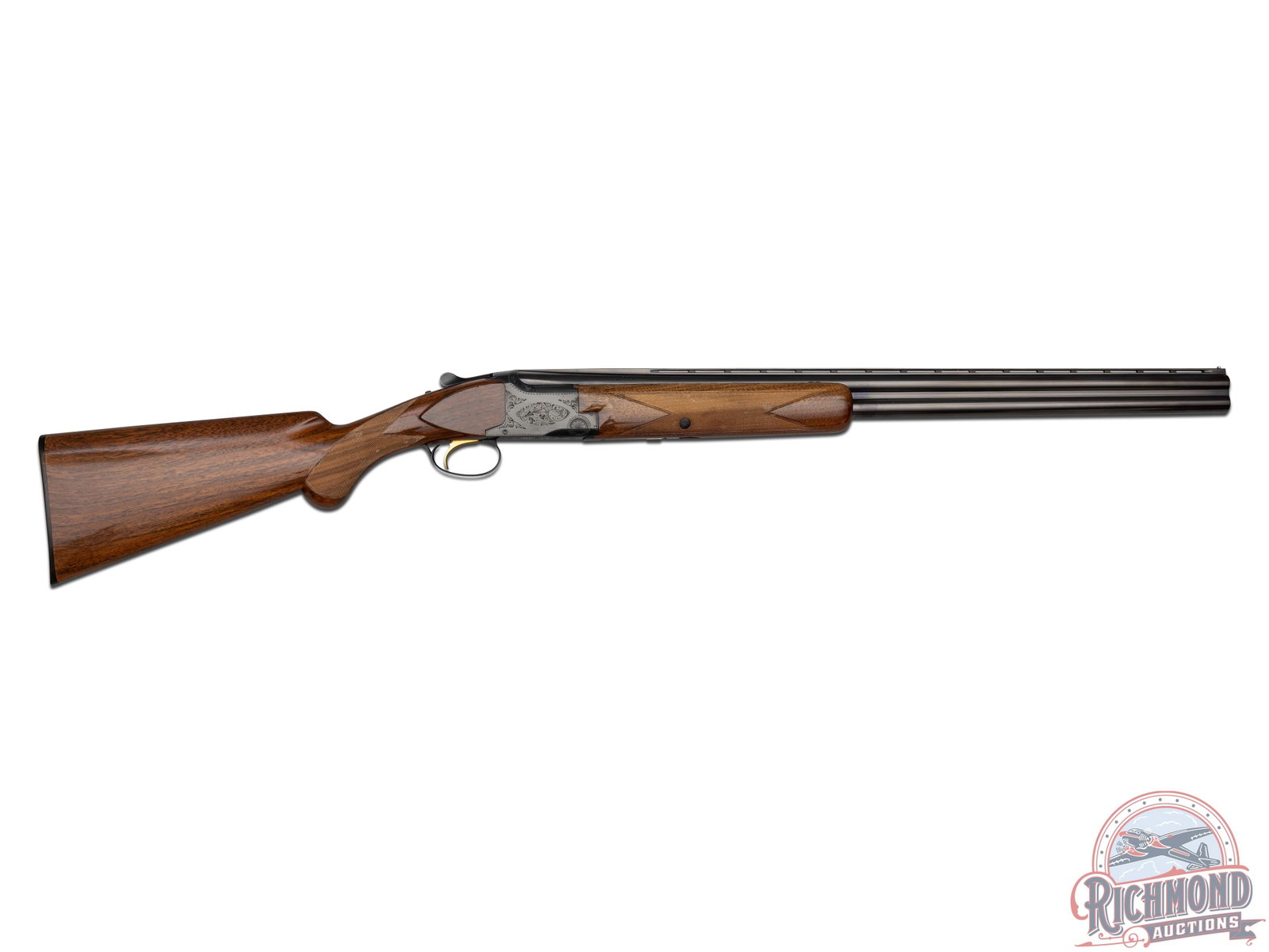 1968 Browning Superposed Lightning 12 GA Over/Under Shotgun: Manufactured by Browning in Belgium in 1968. Features 28" blued ventilated rib barrels with a nickel bead front sight. Chambered for 2-3/4" shells with Modified and Improved Cylinder chokes. Blued box