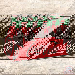 Outstanding 1954 Coca Cola Die Cut Single Sided Tin 12 Pack Sign: Amazing SST (single sided tin) die cut sign has day one color and shine. The field is exceptionally clean overall with light wear and rubs in the lower field. The perimeter is very similar with tiny p