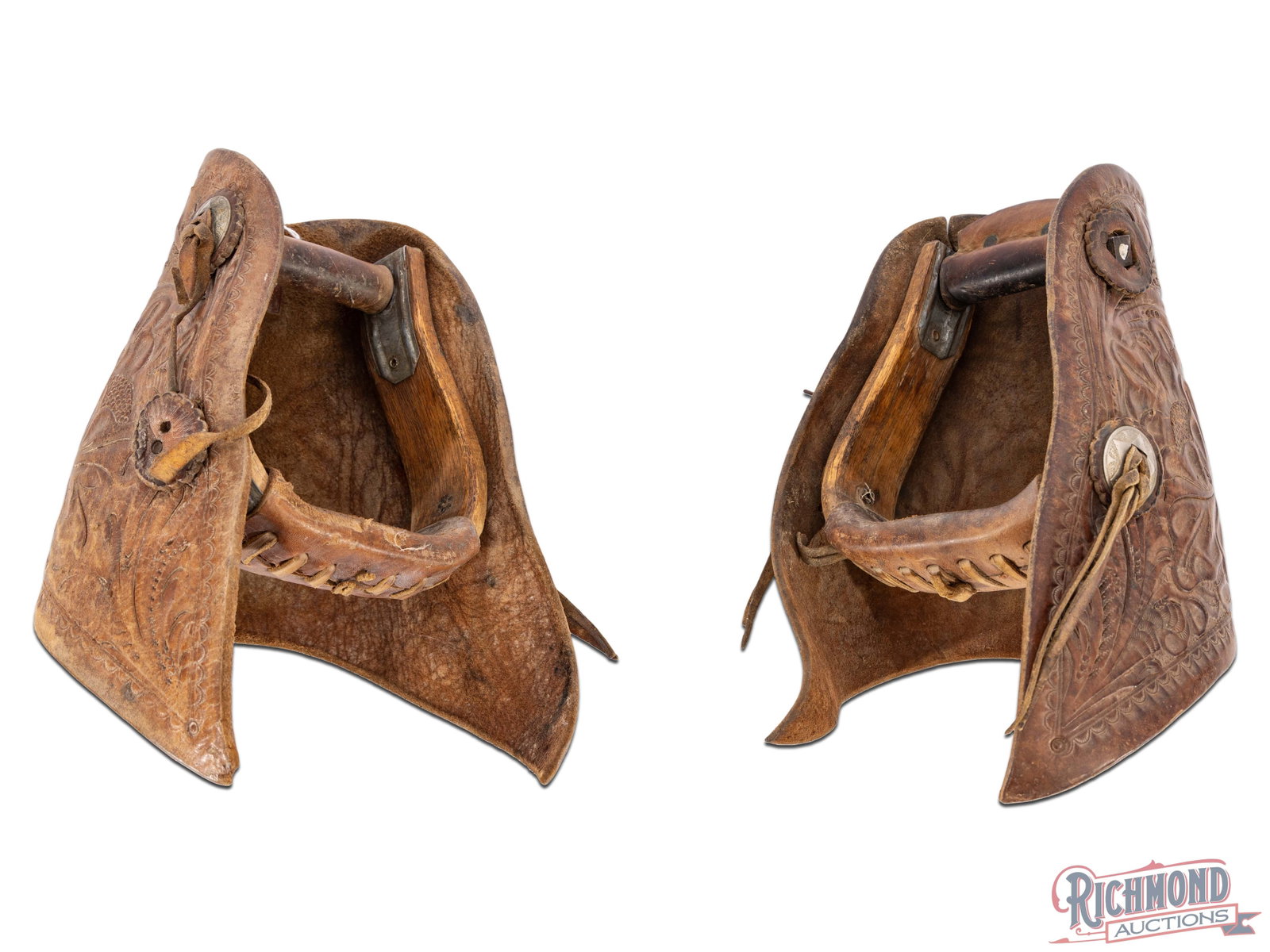 Old Western Saddle Tapaderos Beautiful Leather Tooled Stirrups: Tapaderos are leather coverings attached to the front of stirrups on a saddle, primarily used in Western riding to protect the rider's feet from brush, weather, and other elements through rough terrai