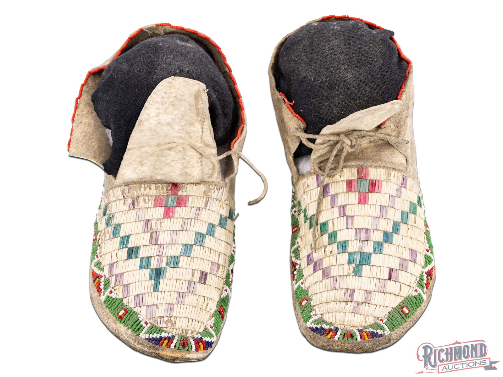 Native American Quilled High Boot Moccasins: Likely from the first quarter of the 20th century. These moccasins are in the high boot form with extensive quill work and thread-sewn seams and thread sewn beads. Approximately 10-1/2" in length.