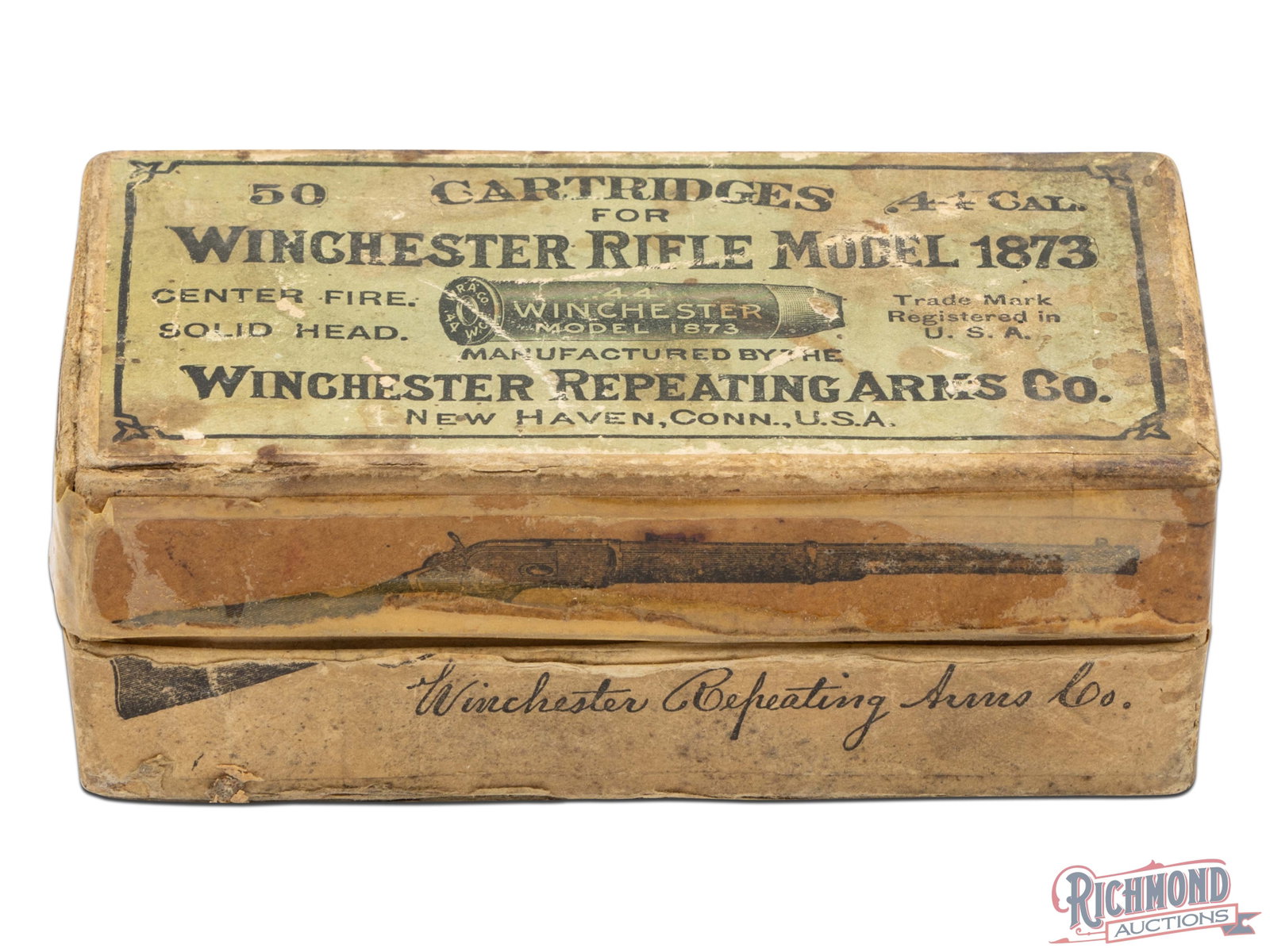 Partial 50 Round Box of Winchester 44 W.C.F. Rounds Marked for the 1873 Rifle: Made by Winchester Repeating Arms Company with box lid having picture of Winchester 1873 Carbine. Box is 50 round and has a light green lid label with "WINCHESTER RIFLE MODEL 1873" marking in black in