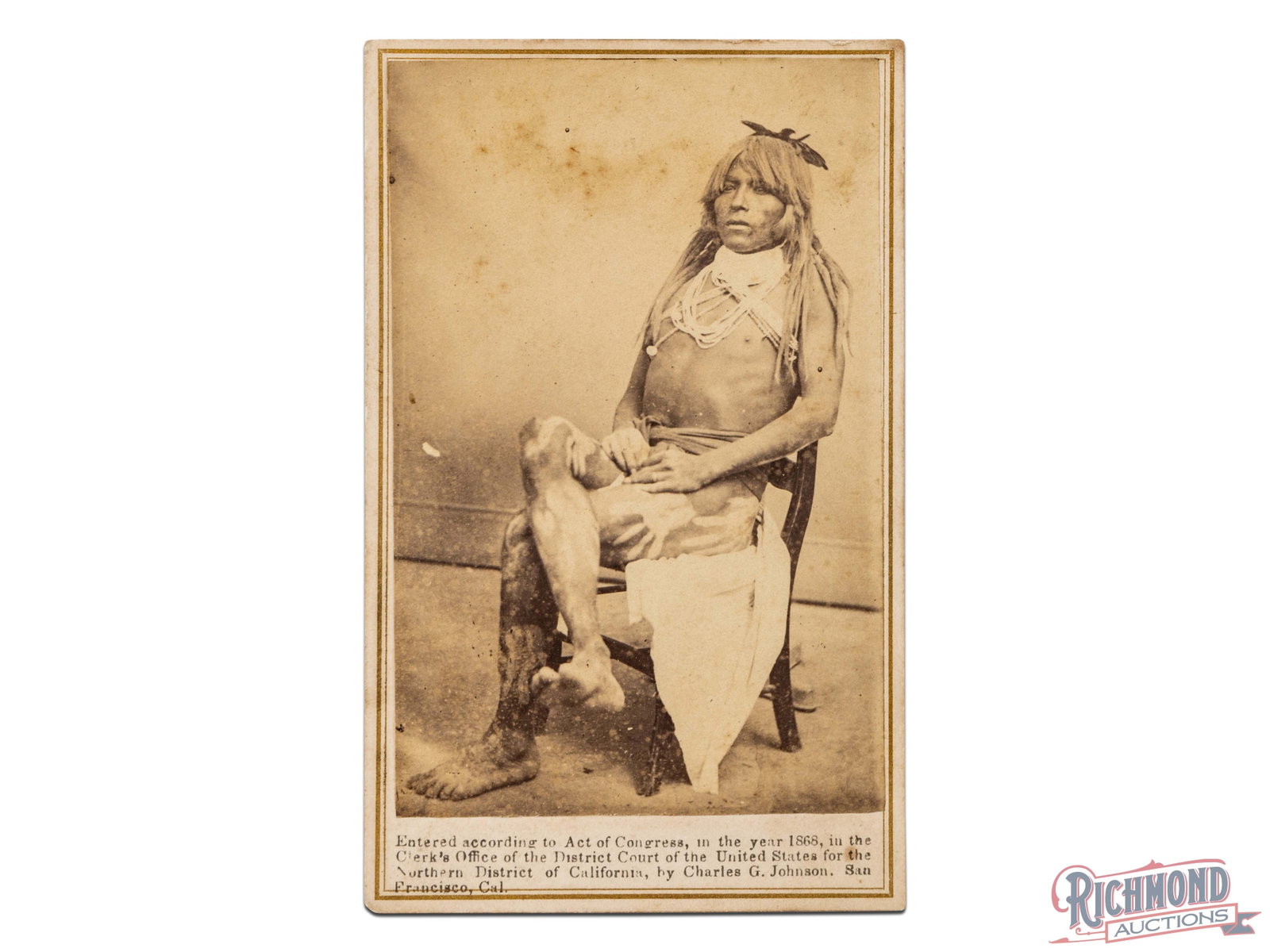 California Native American Indian CDV 1868 Photo: Image done by Charles G. Johnson, San Francisco, CAL. Seated Native American adorns white paint handprints on his thighs and hips. Wearing elaborate necklace likely showing importance of his position 