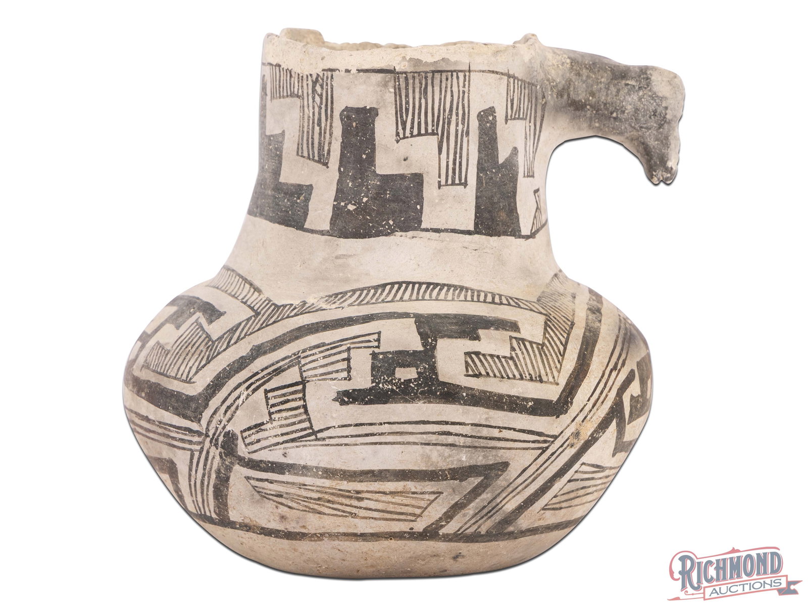 Anasazi Black on White Duck Effigy Pottery Vessel: Small areas of pitting and small areas of paint loss. Possible small repair to animal head or perhaps just wear from age. Chipping around rim. Overall in good solid condition. Retains inventory or fil
