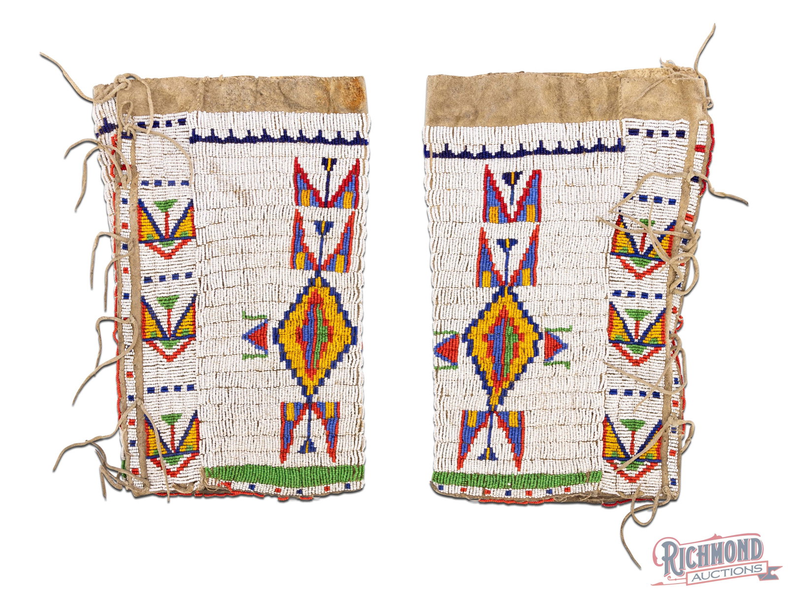 A Fine Matched Pair of Native American Plains Leggings: Beaded Plains leggings still together as a matched pair. Brain-tanned rawhide is in good original condition. There is a trade cloth patched period repair to one of the leggings in a small area. The be