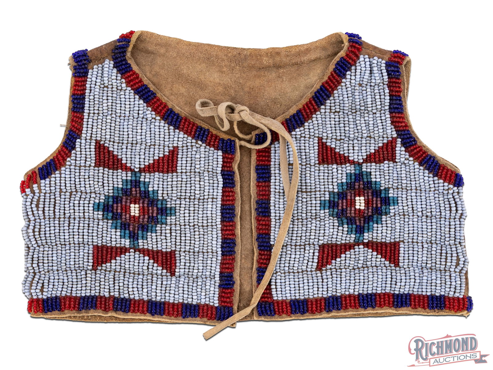 Native American Beaded Child's Vest Plains Origin Possibly Sioux: A nicely beaded child's vest on processed leather. Potentially Sioux. Most likely dating from the first quarter of the 20th century. Approximately 8-1/2" wide and 5-1/2" in length.