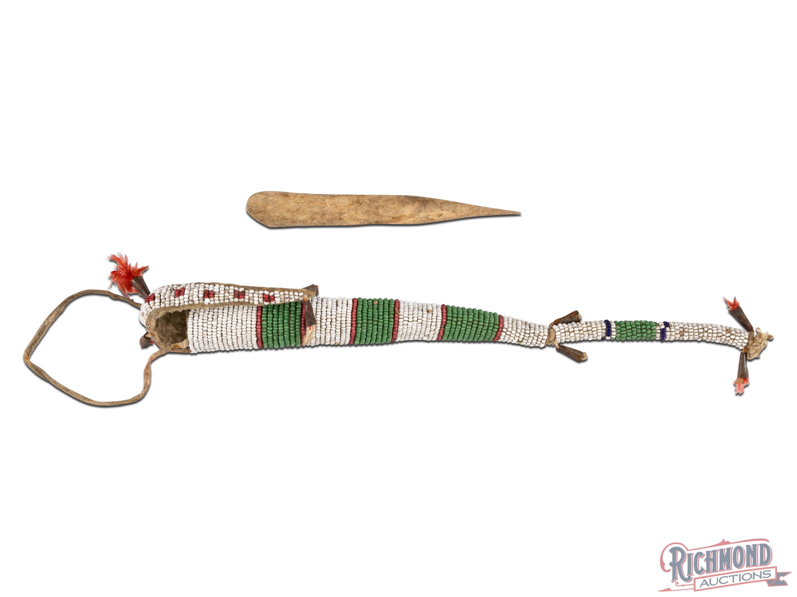 Beaded Native American Plains Awl Case with Bone Awl: Likely dating from the first quarter of the 20th century. This Awl case contains a small bone awl that may be original to the piece. Small areas of bead loss, rust spots on cones and other light loss 