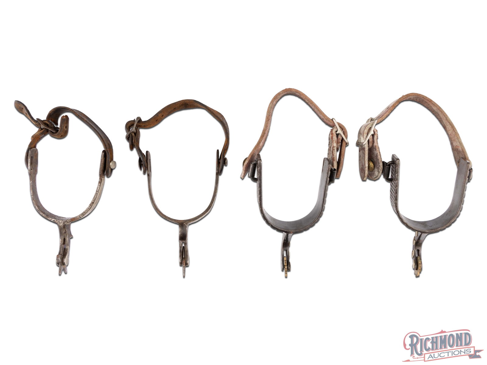 Two Pair of Cowboy Spurs Including Older Pair with 5 Point Rowels: Two pair of spurs, one with 10 Point Brass Rowels and processed red leather straps. The other pair showing good age unmarked with 5 Point Rowels and old leather straps. One strap broken. Light rust an