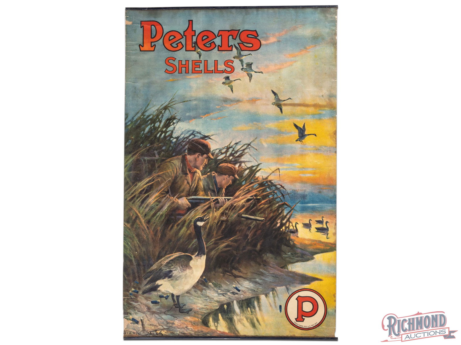 Peters Shells Advertising Display Sign w/ Hunt Scene: Paper advertising sign with metal bands has very good color. The field is clean with minor bends in the upper fields. The perimeter has horizontal bends at the top with edge tears and small chips. The