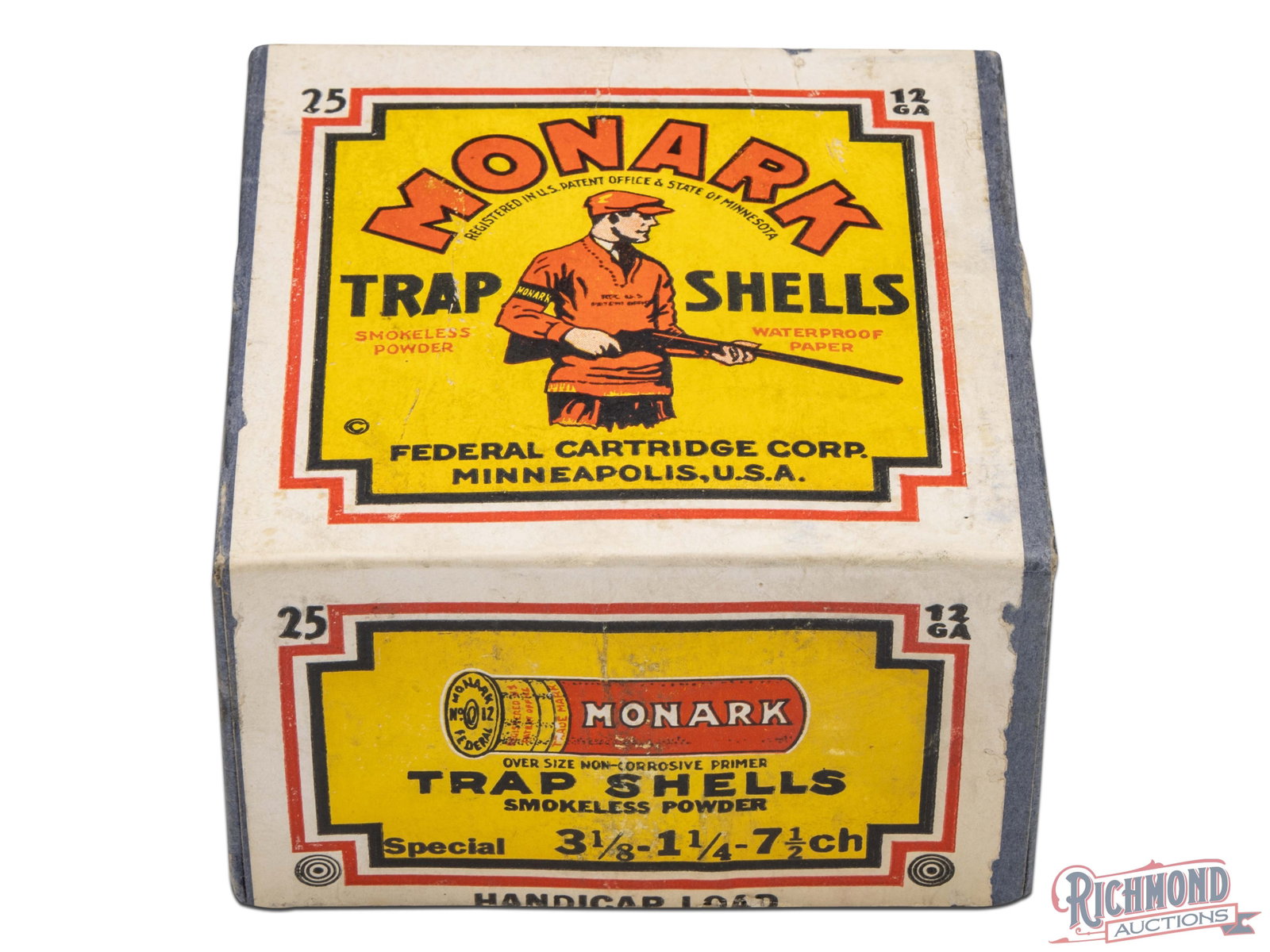 Empty 25 Round Federal Cartridge Company 12 Gauge Two Piece Monark Trap Load Shell Box: Made by Federal Cartridge Company Minneapolis, Minnesota. Lot features an opened empty 25 round 12 Gauge 2-3/4" two piece box of "MONARK" shotgun shells with yellow/ red "TRAP SHOOTER" label with "MON
