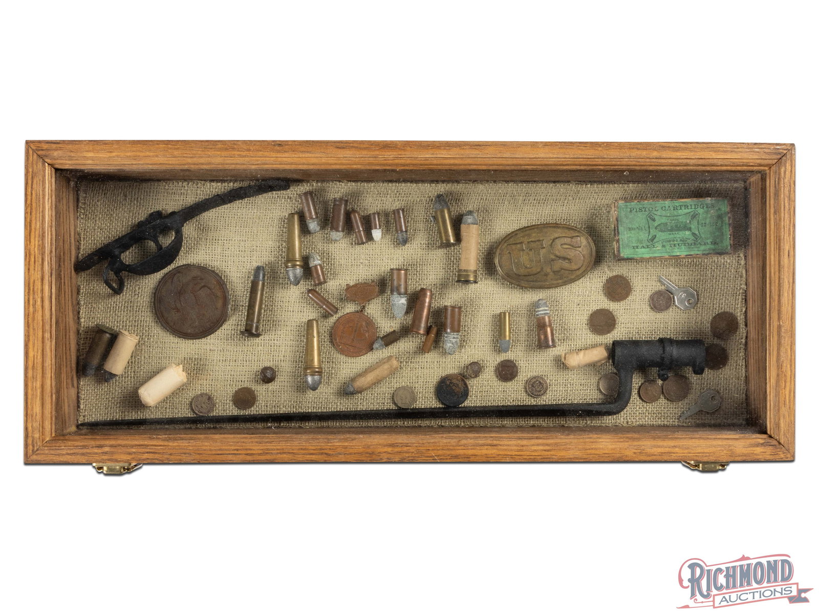 Display Case Full of Civil War Relics: Wooden glass lid case measuring 24" x 10" x 2" with 40+ items including Civil War Period coins, dug musket parts, belt buckles, ammunition and Confederate 1907 Richmond, Virginia Reunion Medal and she
