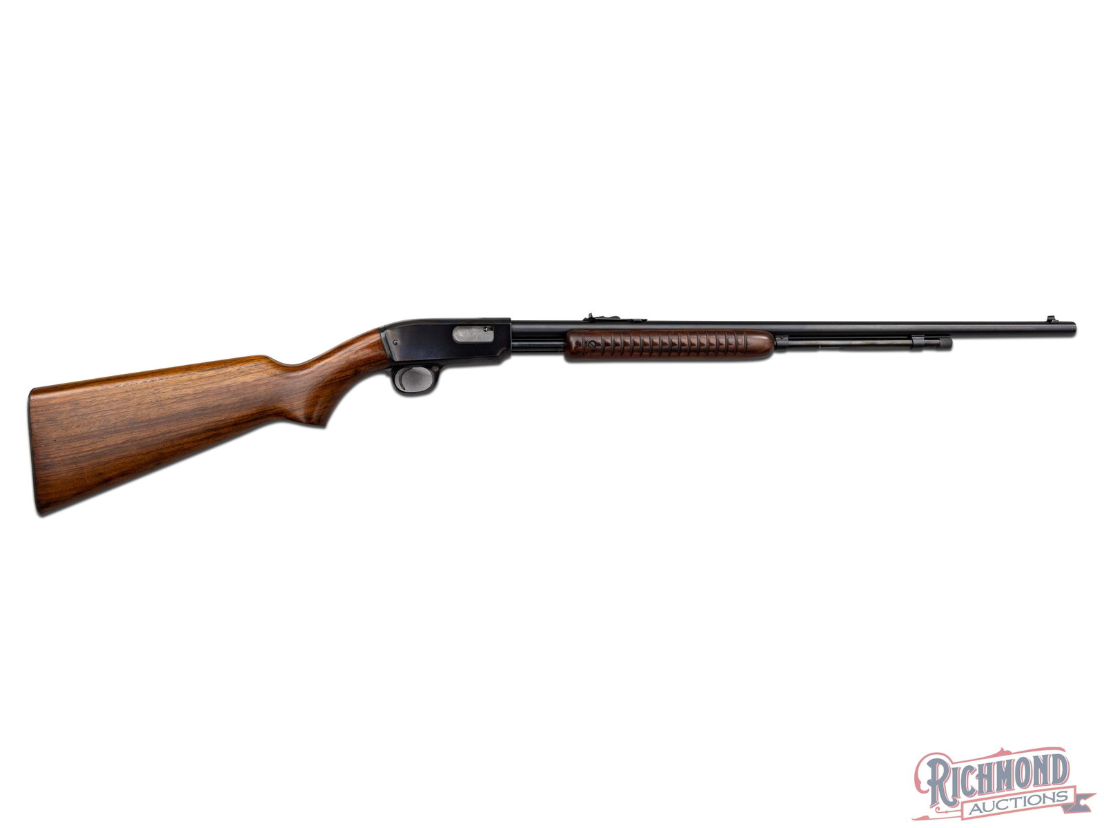 Winchester Model 61 Slide Action Rifle in 22 S/L/LR: Made by Winchester Repeating Arms Company in 1955. Gun has blued Winchester Proof steel 24" round barrel with standard sights. Barrel is marked with Winchester two line address behind rear sight with 