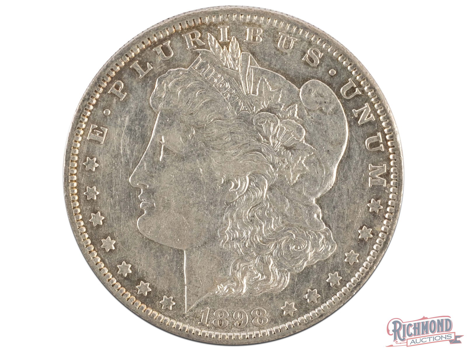 Attractive About Uncirculated 1898-S Specimen: With mass melting of 90% coinage during the 20th and 21st Centuries, large amounts of the silver dollar mintages were taken off the market forever. So, just looking at mintage numbers does not provide