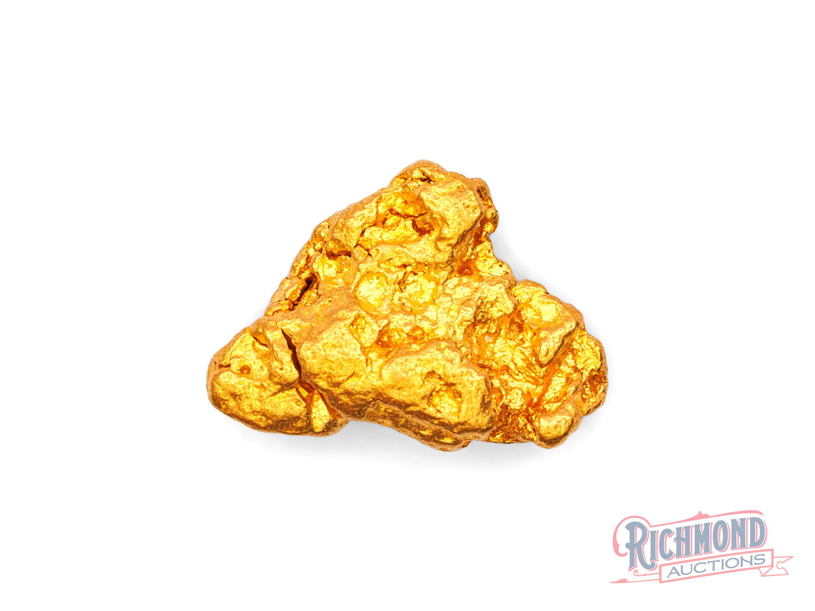 3.3g Natural Gold Nugget: Discovered by a seasoned prospector, this nugget was stored away shortly after being found. Its rounded shape tells the story of extensive water travel. PURITY: 22k.