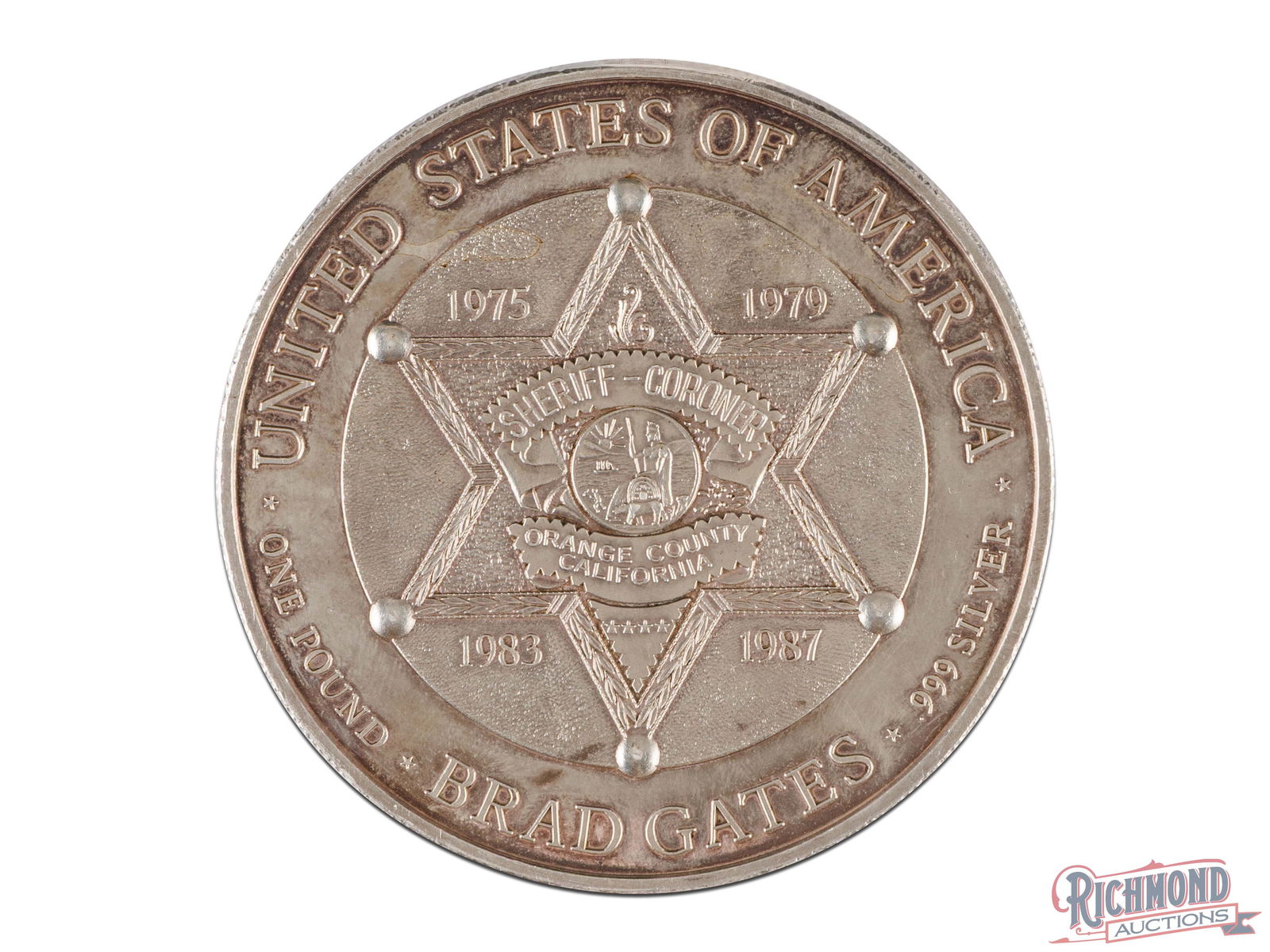 John Wayne "The Duke" One Pound Fine Silver Round: This outstanding round is sure to grab the attention of individuals that love variety to their silver investments. On the front of this 16 troy ounce silver round is John Wayne wearing a cowboy hat. A