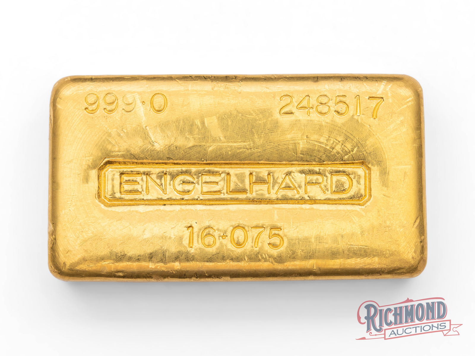 Rare-Weight 1/2 Kilo (16.075 oz) Engelhard Gold Bar: Here is a seldom-seen half kilogram gold bar produced by Engelhard. This loaf-style bar features the Engelhard logo prominently displayed in the center, the three 9 (0.9990) purity in the upper left