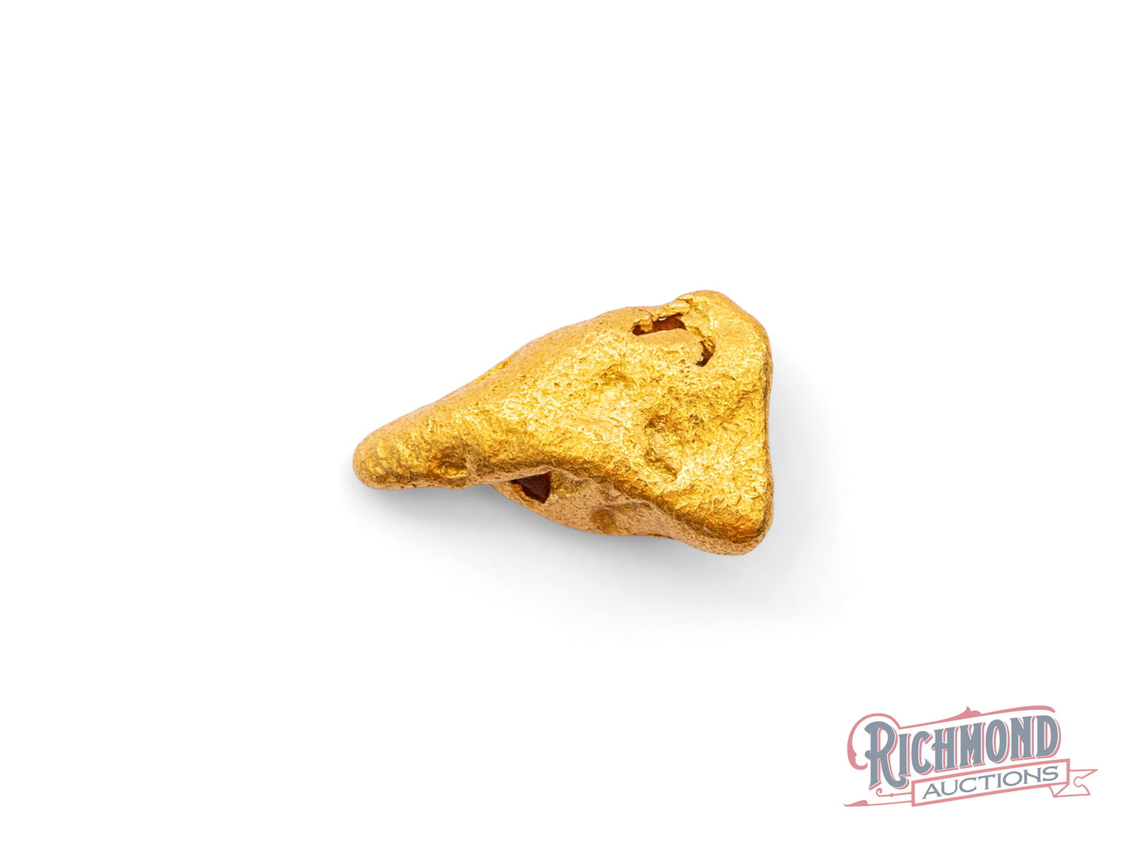 8.6g Natural Gold Nugget: This beautifully water-worn gold nugget has travelled far from its original source, shaped and softened over time as it moved through ancient watercourses. Centuries of natural tumbling have rounded i