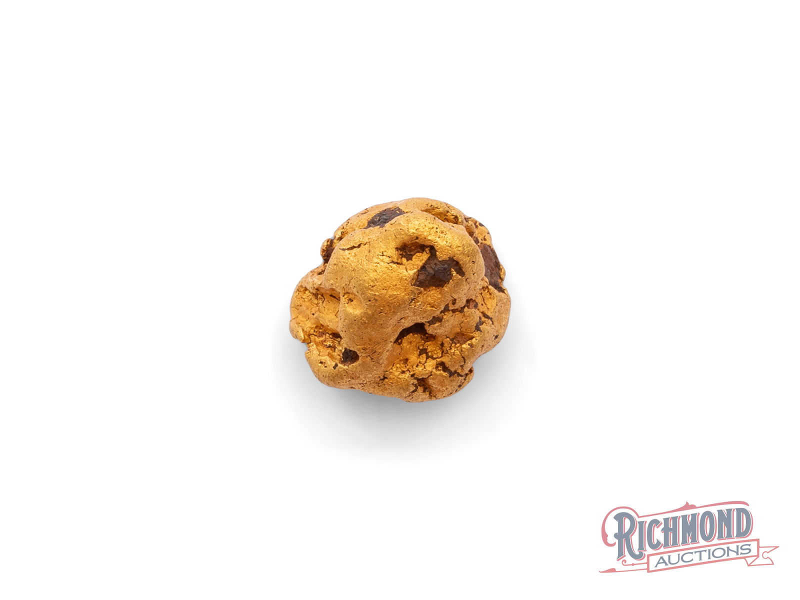 Chunky 25g Natural Gold Nugget: This round, chunky gold nugget bears clear traces of ironstone, indicating it originally formed within an ironstone lode. Over millennia, natural forces slowly broke it free from its host rock,
