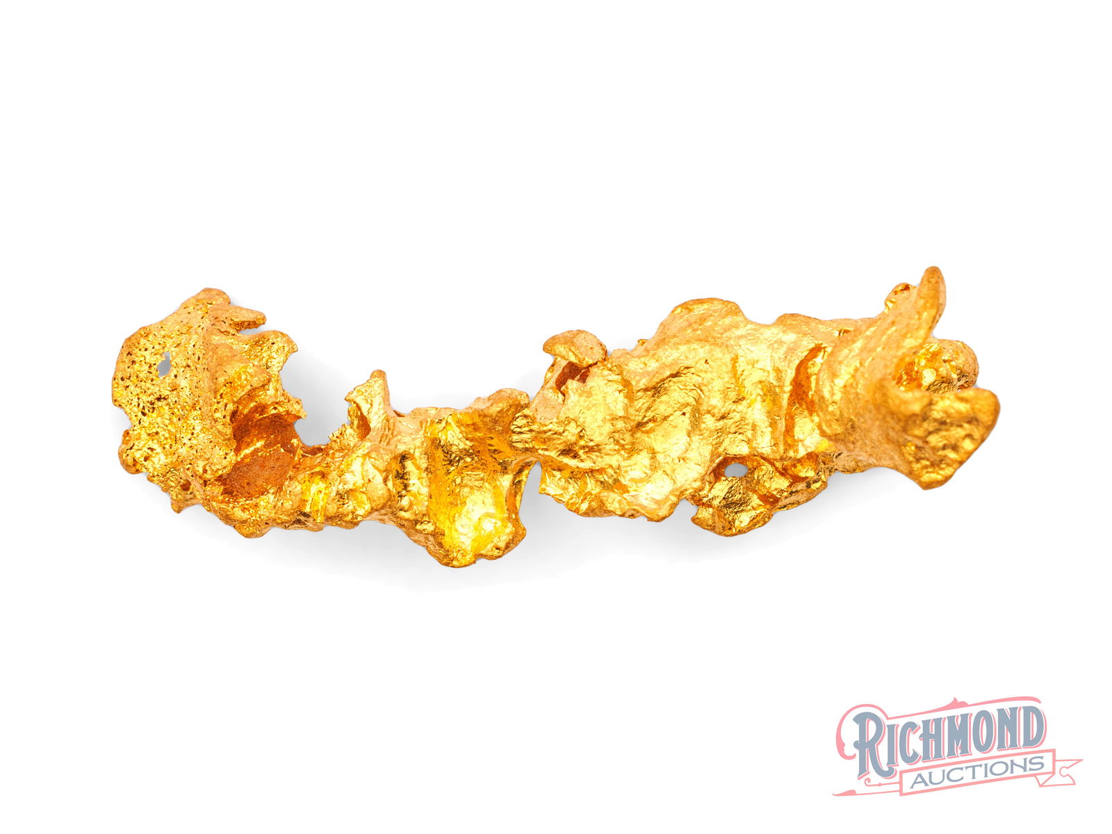 7.6g Natural Gold Nugget w/ Intricate Folded Aluminum Foil Appearance: This nugget was recovered close to the surface in the Golden Triangle, a region famed for producing some of the most historic nuggets ever discovered. Its smooth, water-worn form shows clear evidence