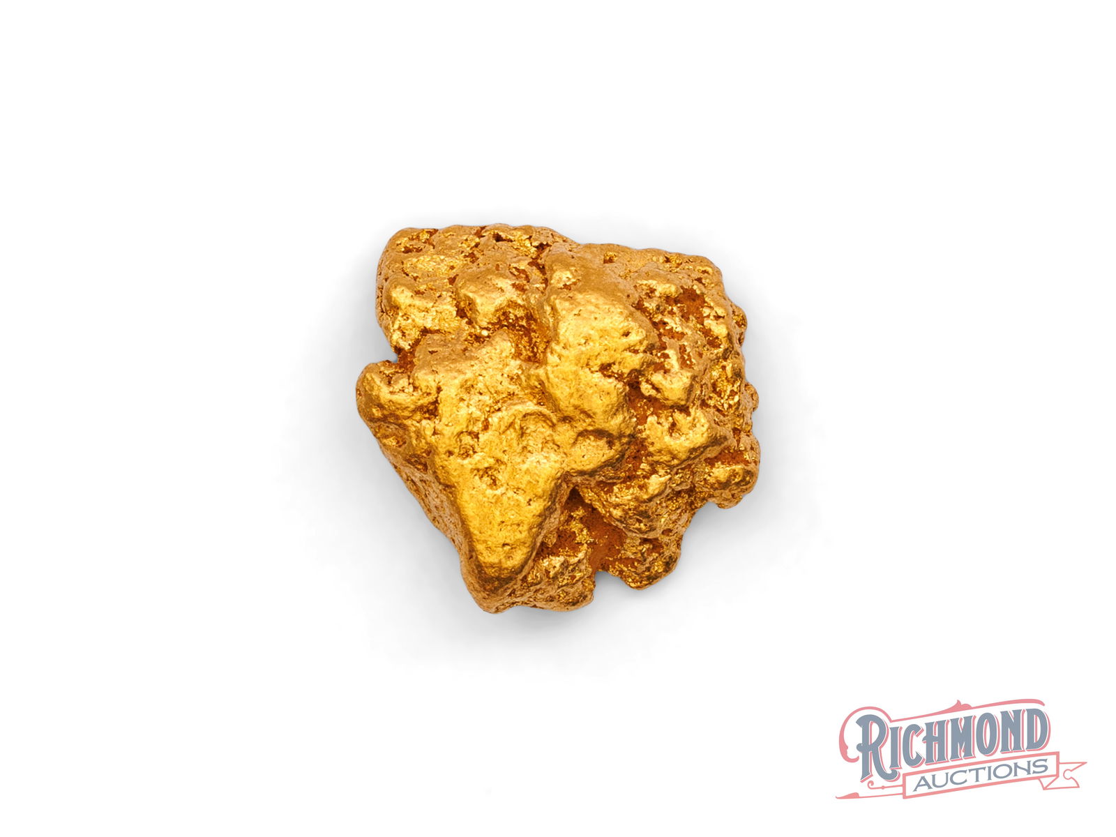 4.3g Natural Gold Nugget: Locked in a vault for over forty years, this nugget comes from remote Western Australia. Its smooth, rounded shape shows it was shaped by water as it moved through a natural watercourse. PURITY: 22k.