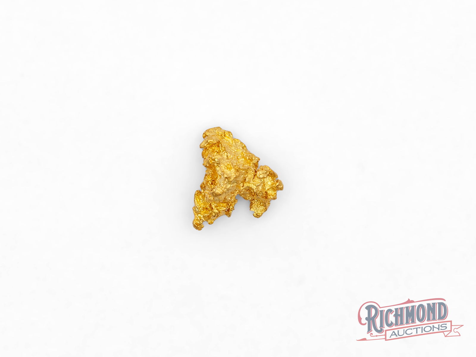 0.8g Natural Golden Pyramid Gold Nugget: This natural gold nugget has formed into a shape reminiscent of a small pyramid, a rare and striking structure created entirely by natural geological processes. Its defined angles and rising form give