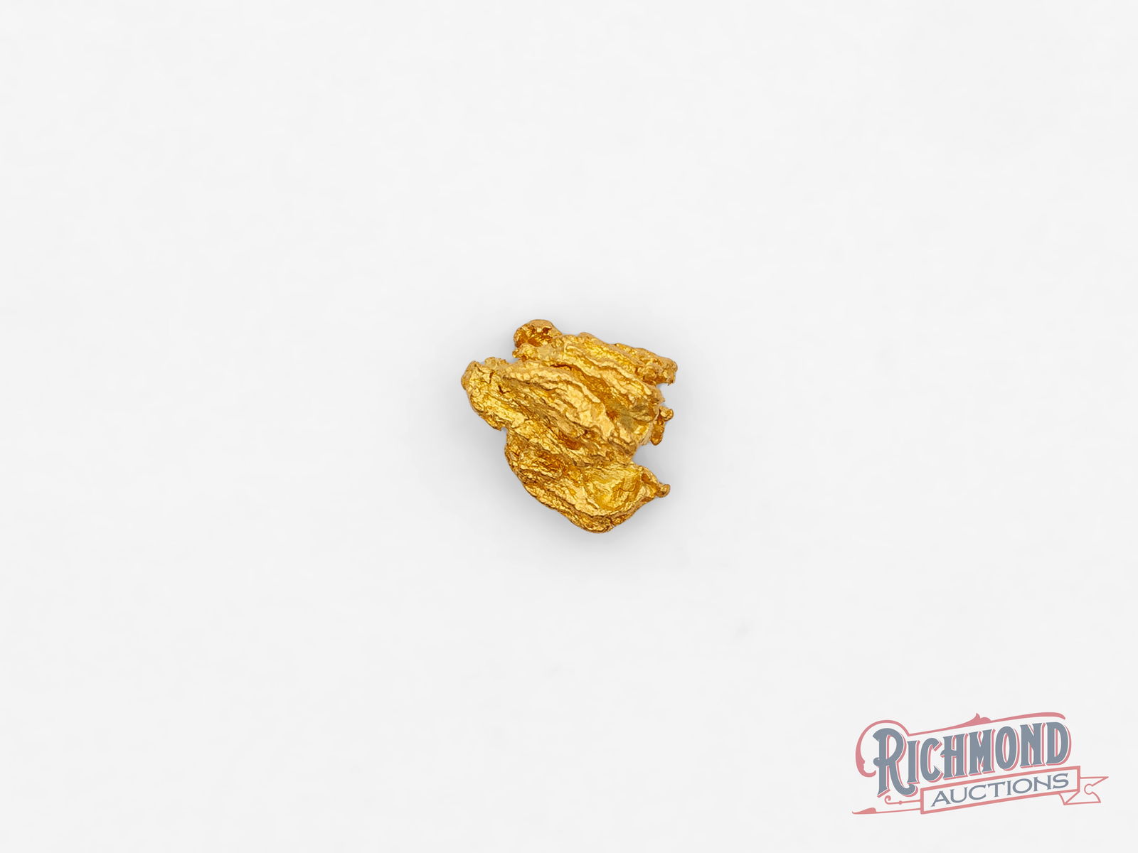 0.8g Natural Gold Nugget: Found by the Mahoney family in the historic Kanowna goldfields, this alluvial gold nugget is a rare and natural original. With an estimated purity of 22 carats, it stands out for its exceptional luste
