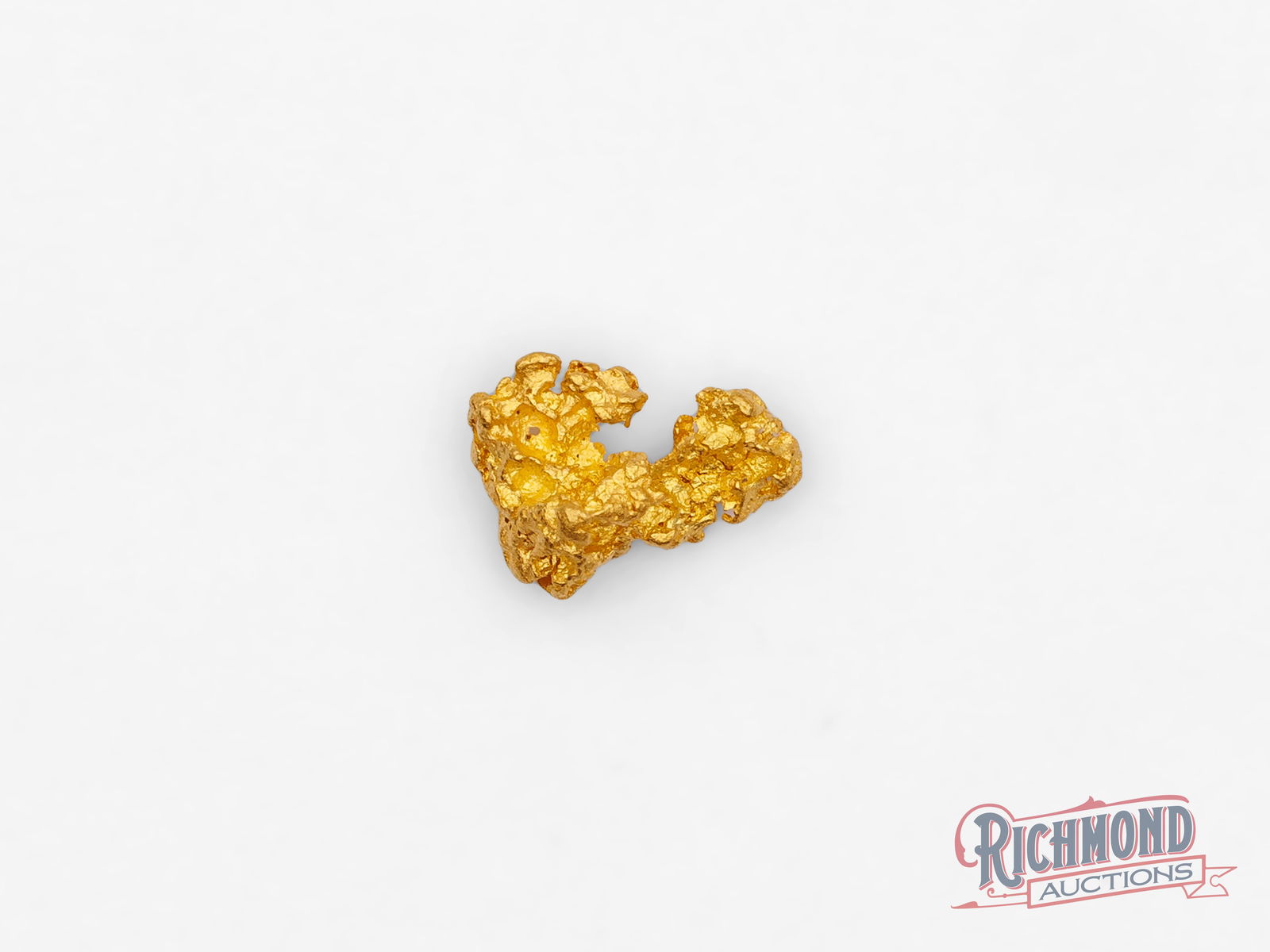 0.9g Natural Gold Nugget: This natural gold nugget has formed into a shape that closely resembles the letter "L," an uncommon and intriguing natural form created entirely by geological processes. Its angular lines and defined