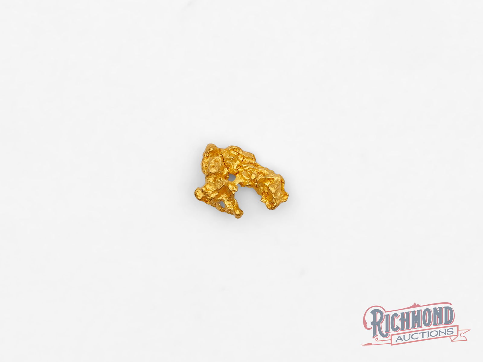 0.4g Natural Gold Nugget: Unearthed in the historic goldfields of Kanowna, this natural nugget was found by the Mahoney family at their small-scale alluvial operation. With an estimated purity of approximately 22 carats, it is