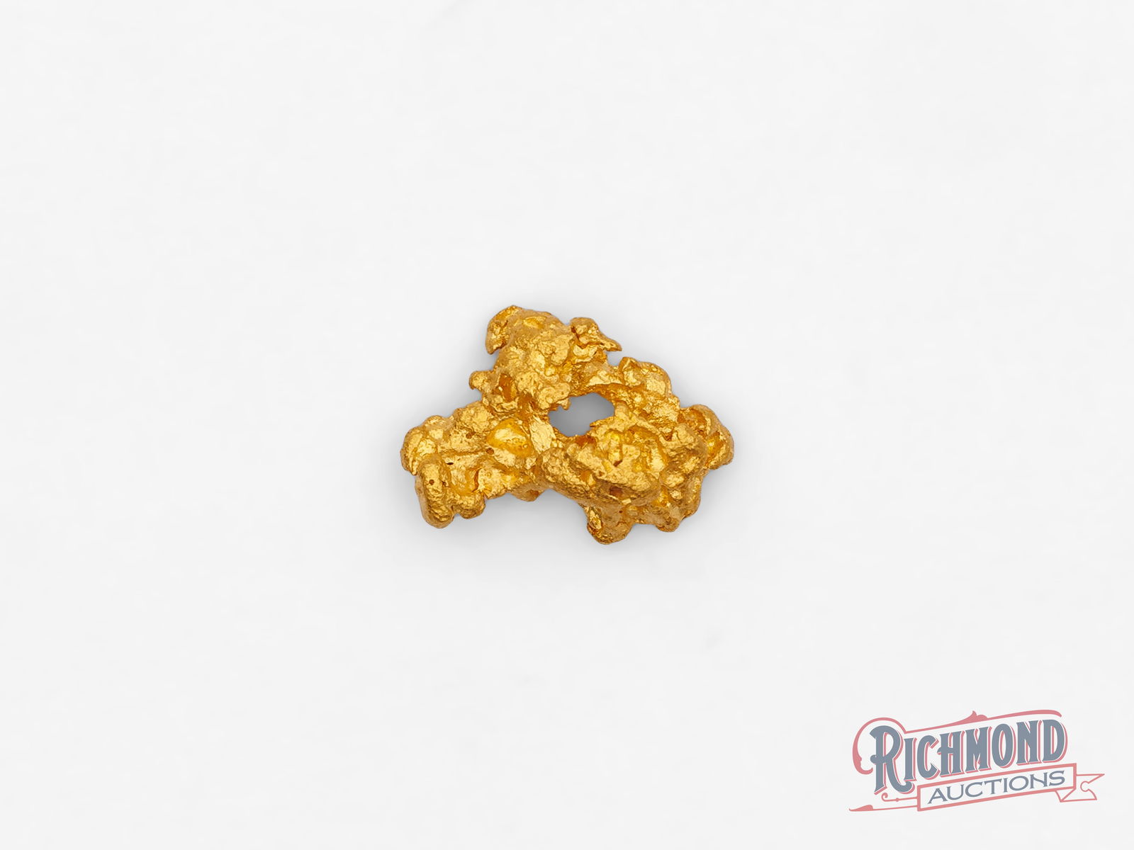 1.1g Natural Gold Nugget: Found through full-time prospecting in the Kalgoorlie Goldfields, this alluvial gold nugget is a rare natural creation. Each surface and contour tells its own story, making it a true individual shaped