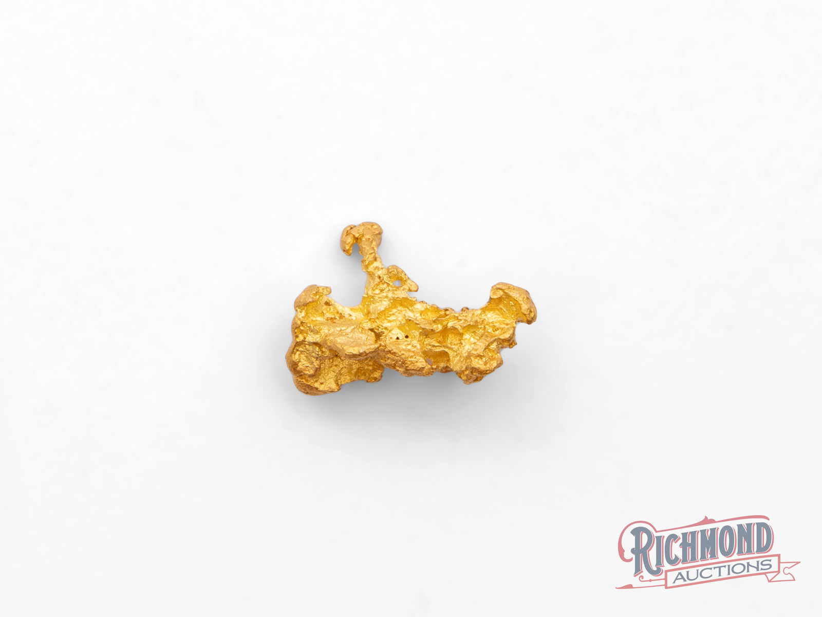 0.8g Natural Gold Nugget w/ Slight Inverted Crystals: his natural gold nugget displays striking inverted crystal structures, formed when gold crystallized inward, leaving delicate cavities and angular impressions within the piece. These features are crea